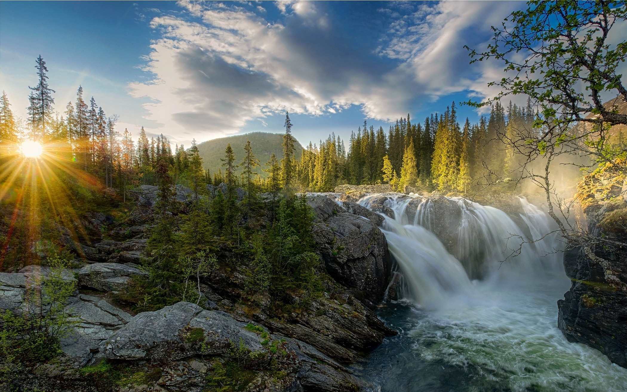 Waterfall in a forest with sunset sun rays HD Wallpaper