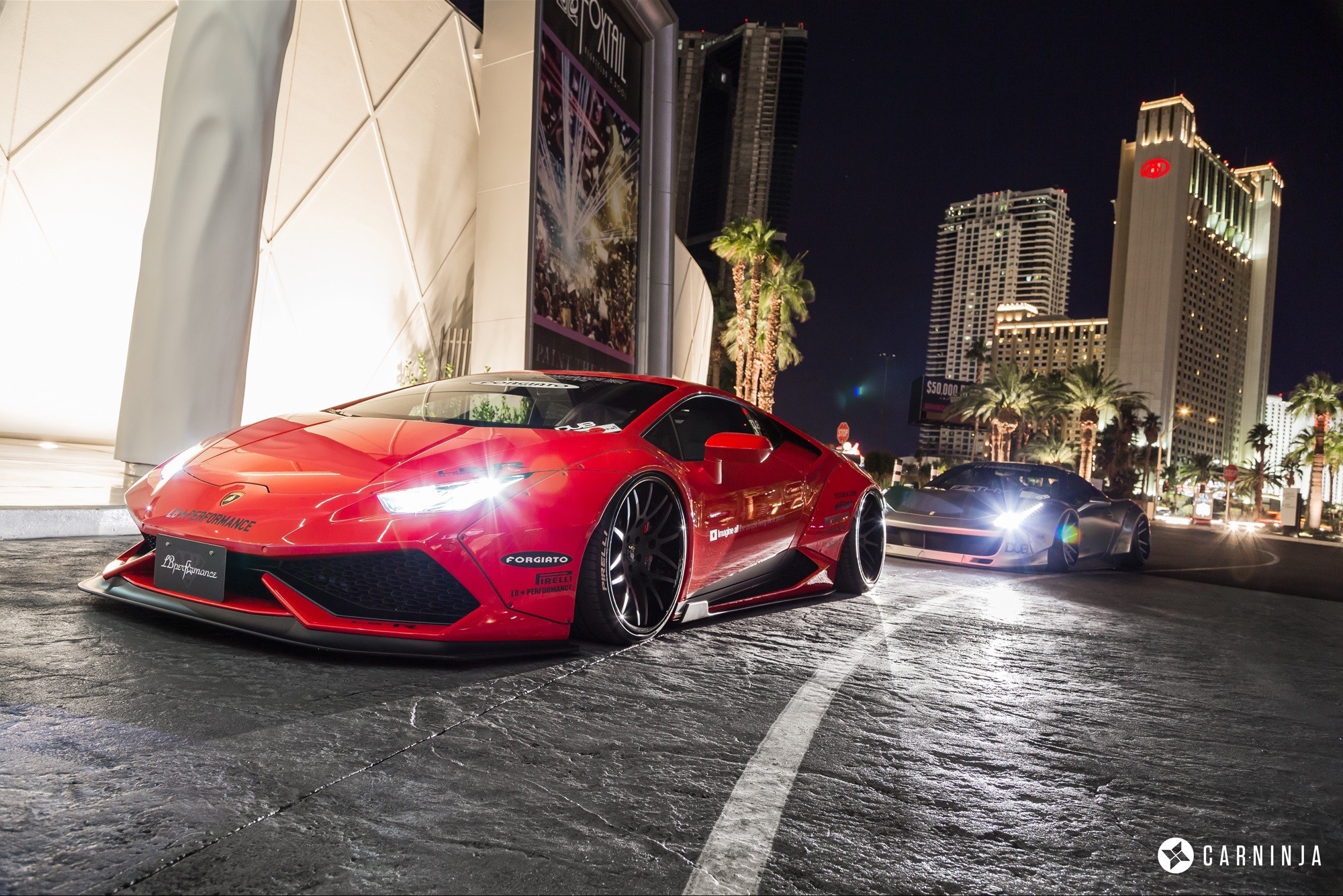 Red Lamborghini Huracan LB Performance and silver supercar at night HD Wallpaper