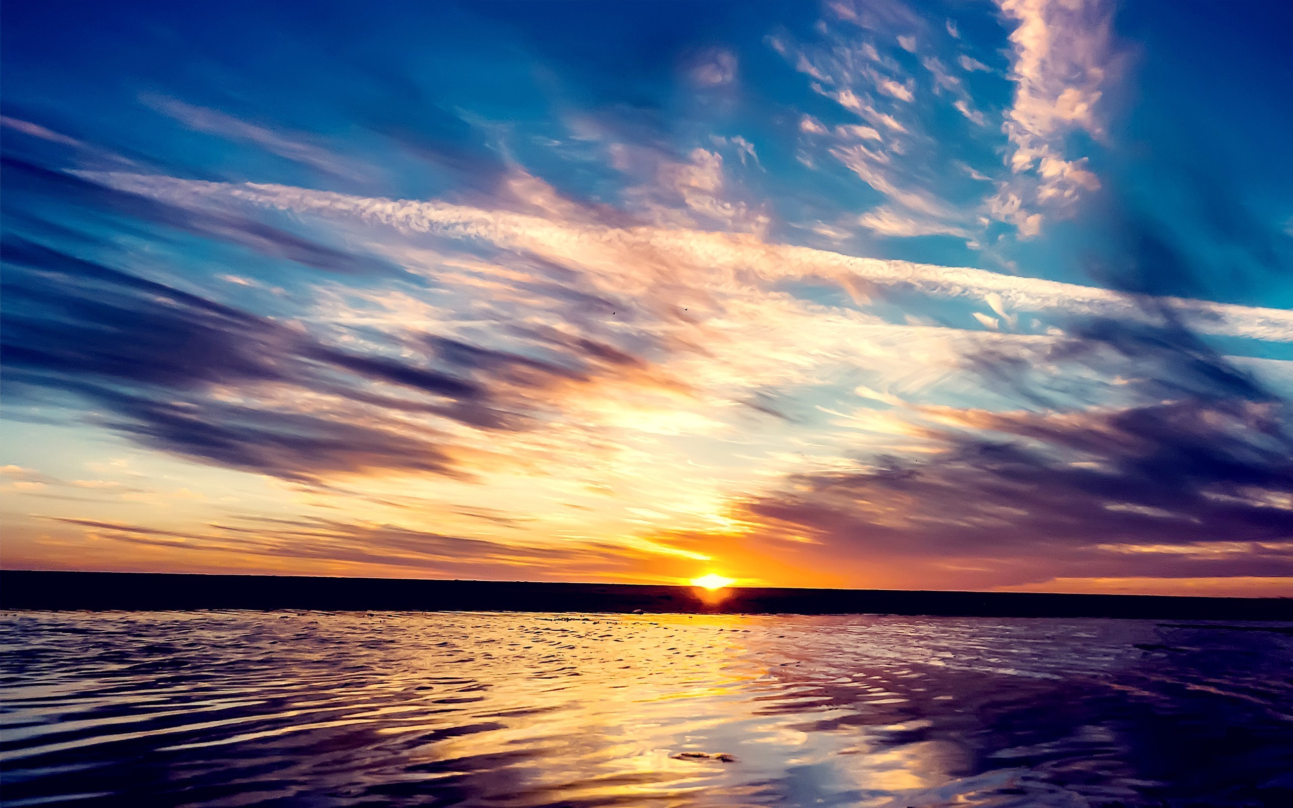 Sunset over the sea with dramatic clouds HD Wallpaper
