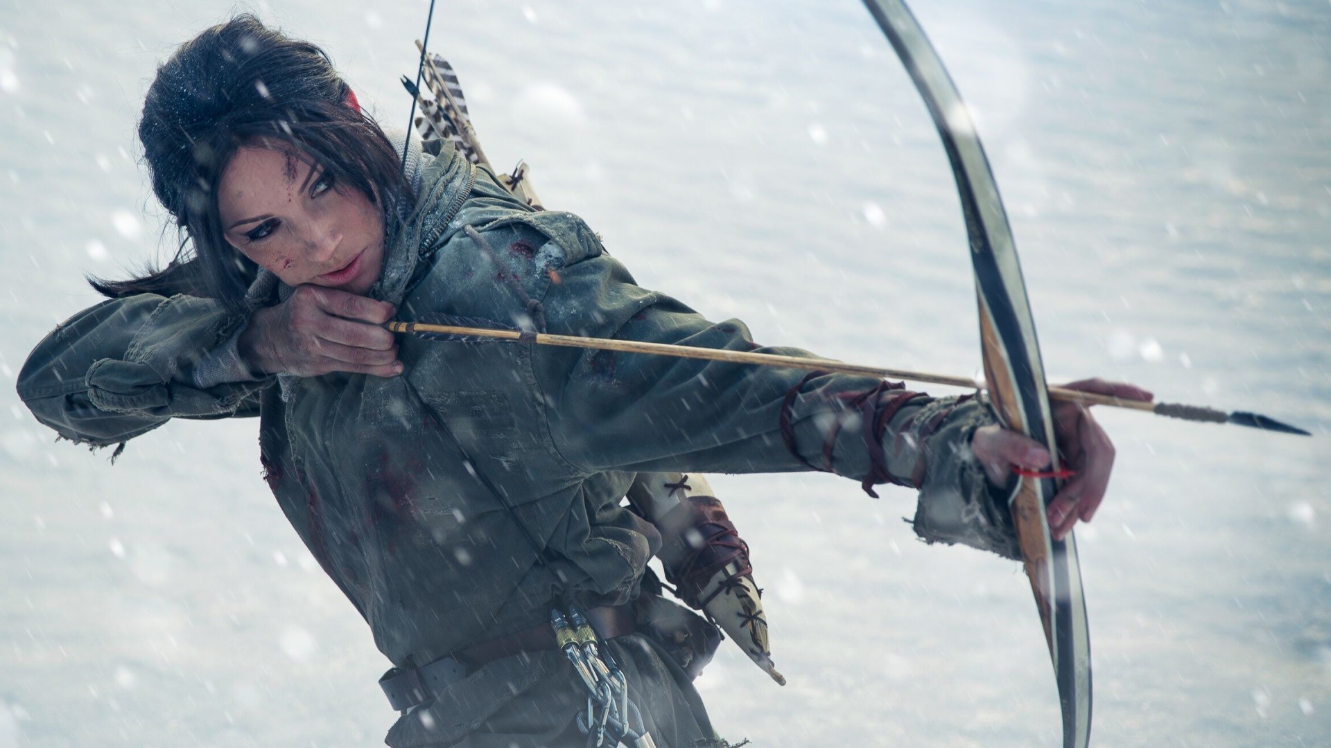 Lara Croft from Tomb Raider aiming a bow in snow HD Wallpaper