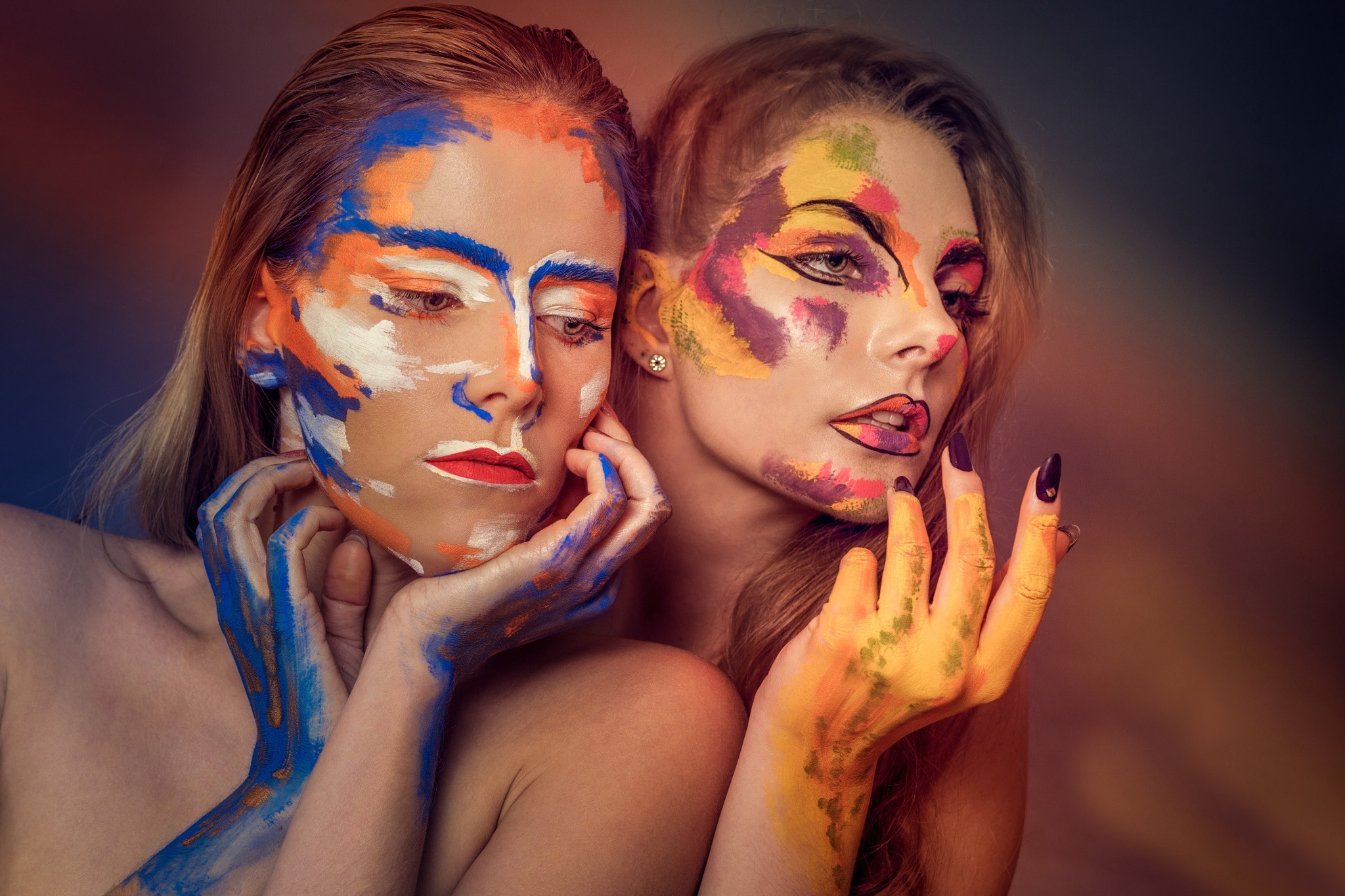 Two women with colorful body paint HD Wallpaper
