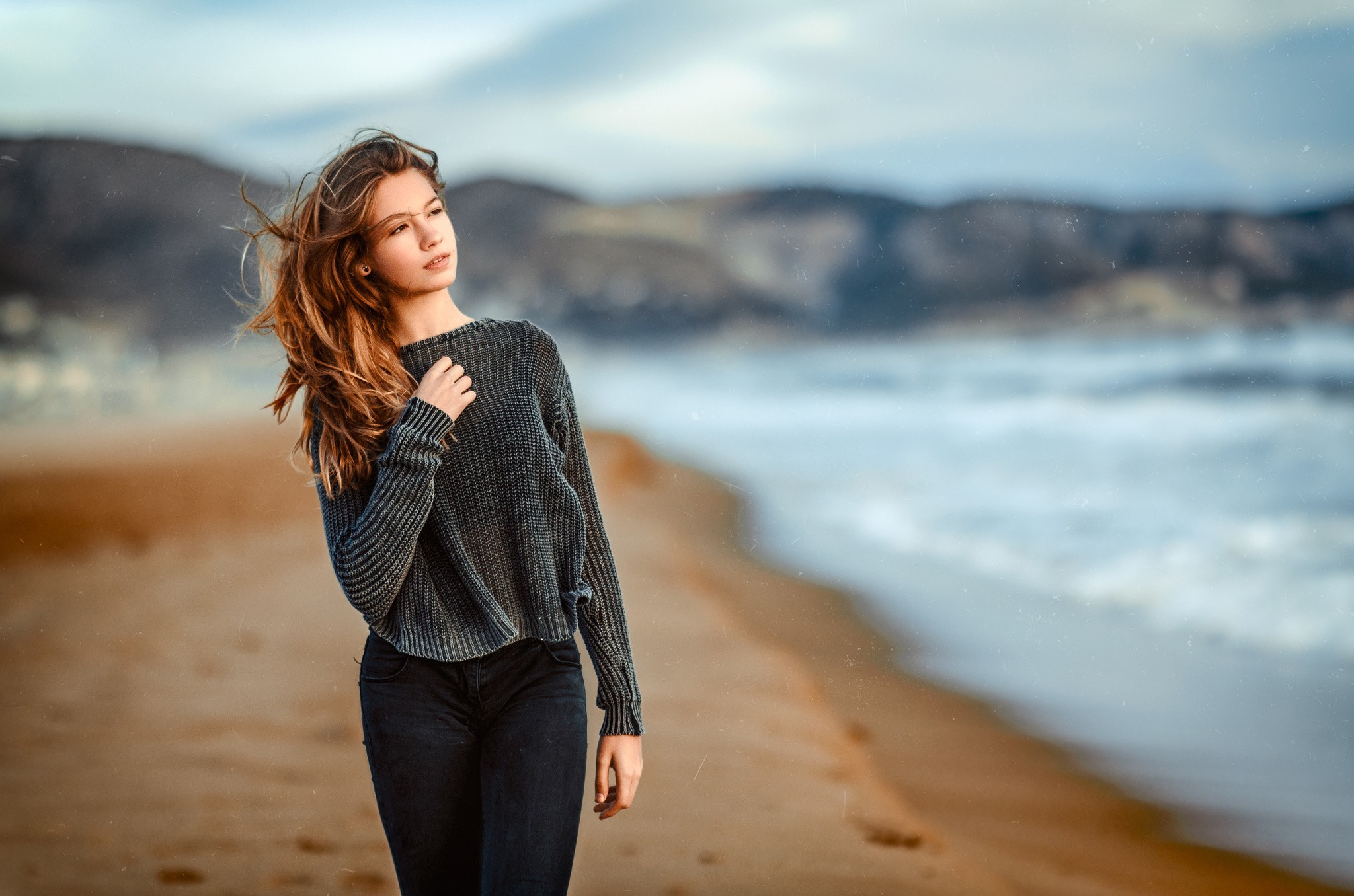 Woman with long hair on a beach HD Wallpaper