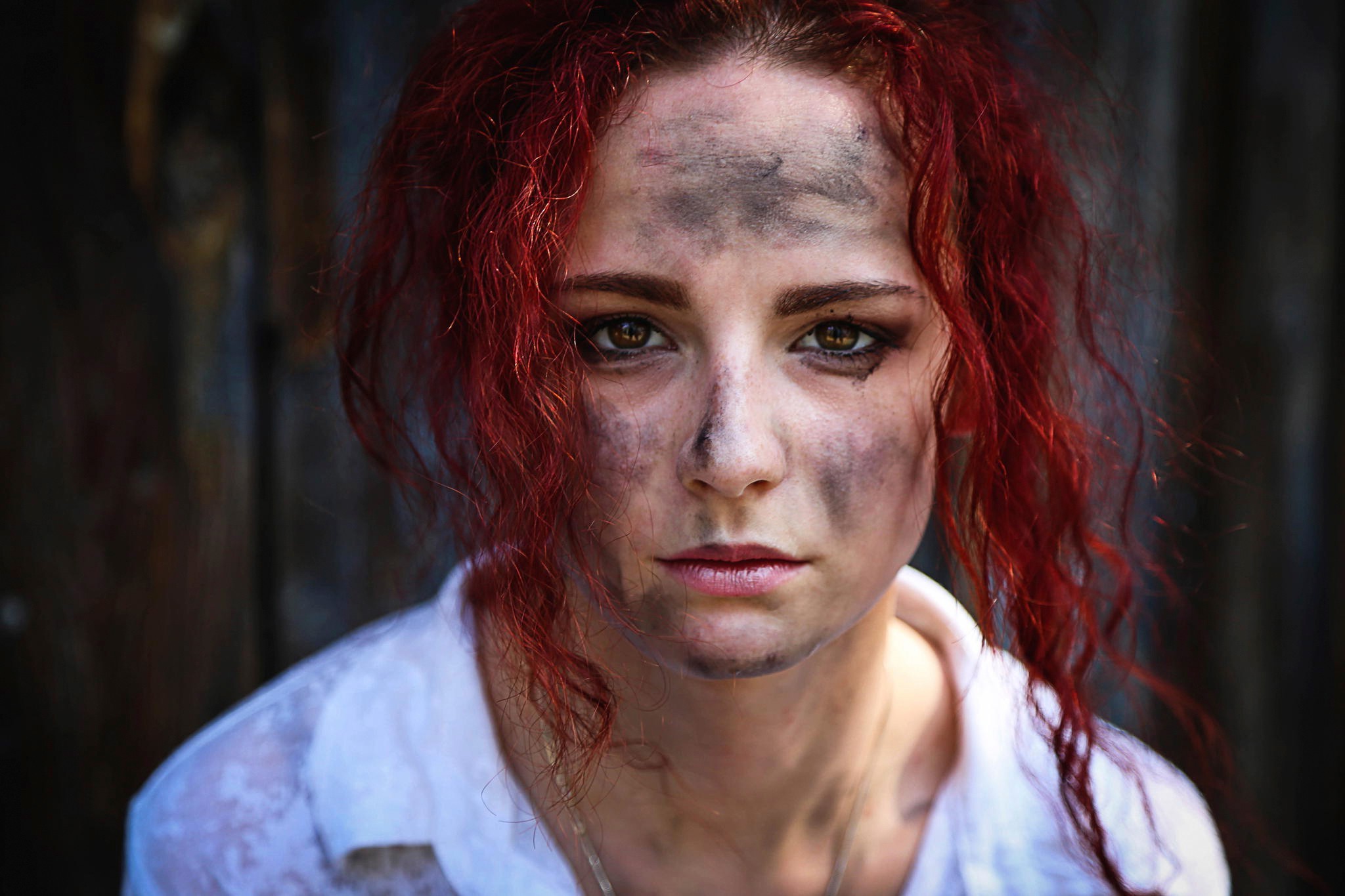 Woman with red hair and dirt on her face HD Wallpaper