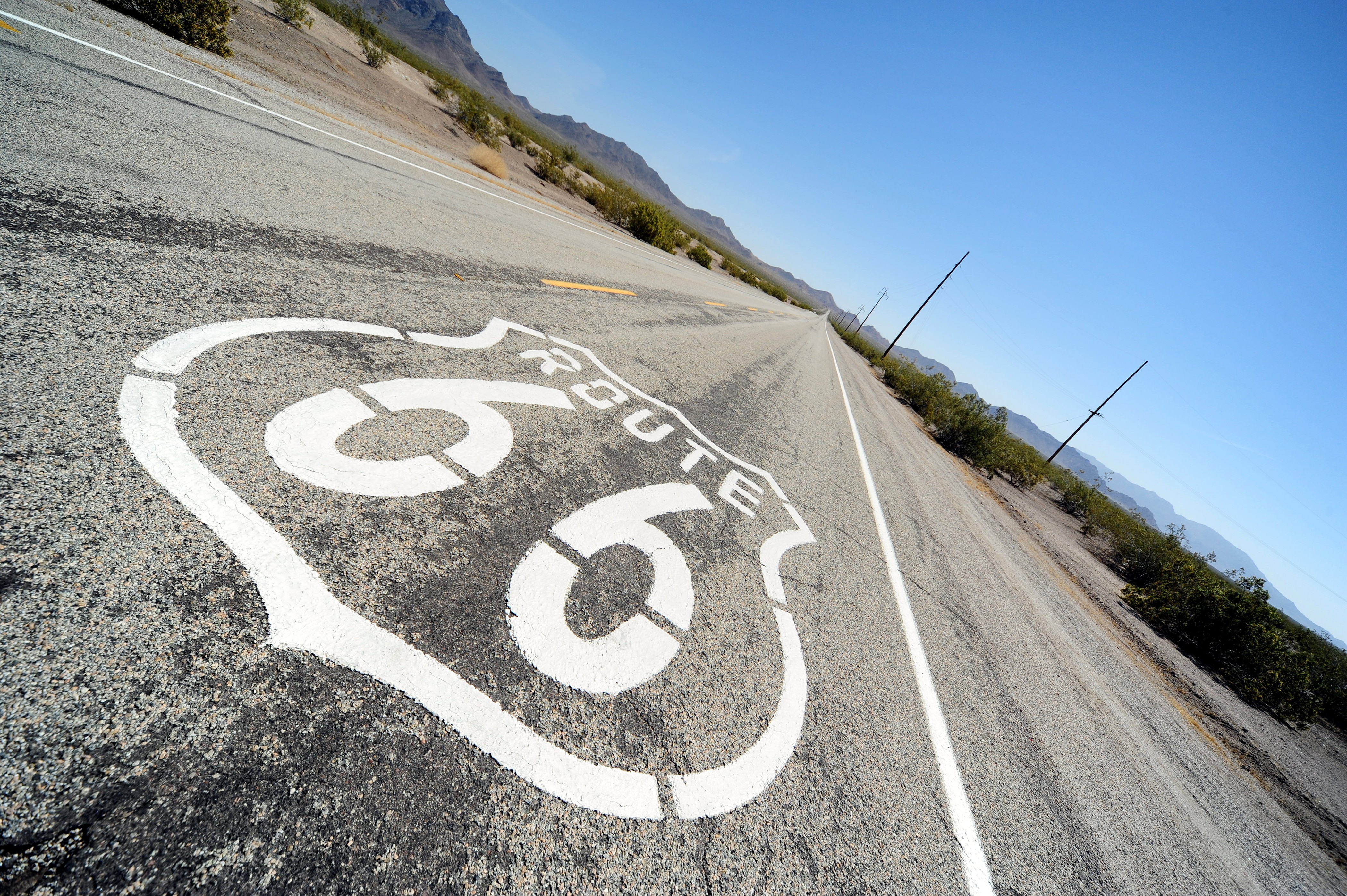 Route 66 road sign painted on asphalt HD Wallpaper