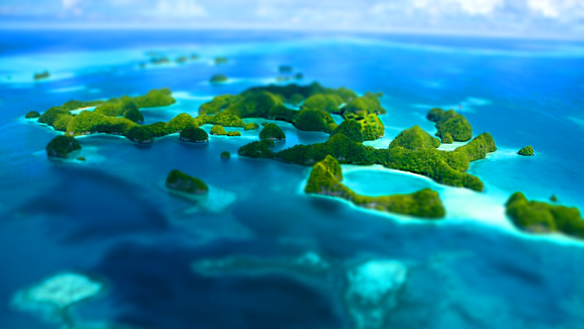 Tilt shift islands in blue ocean HD Wallpaper