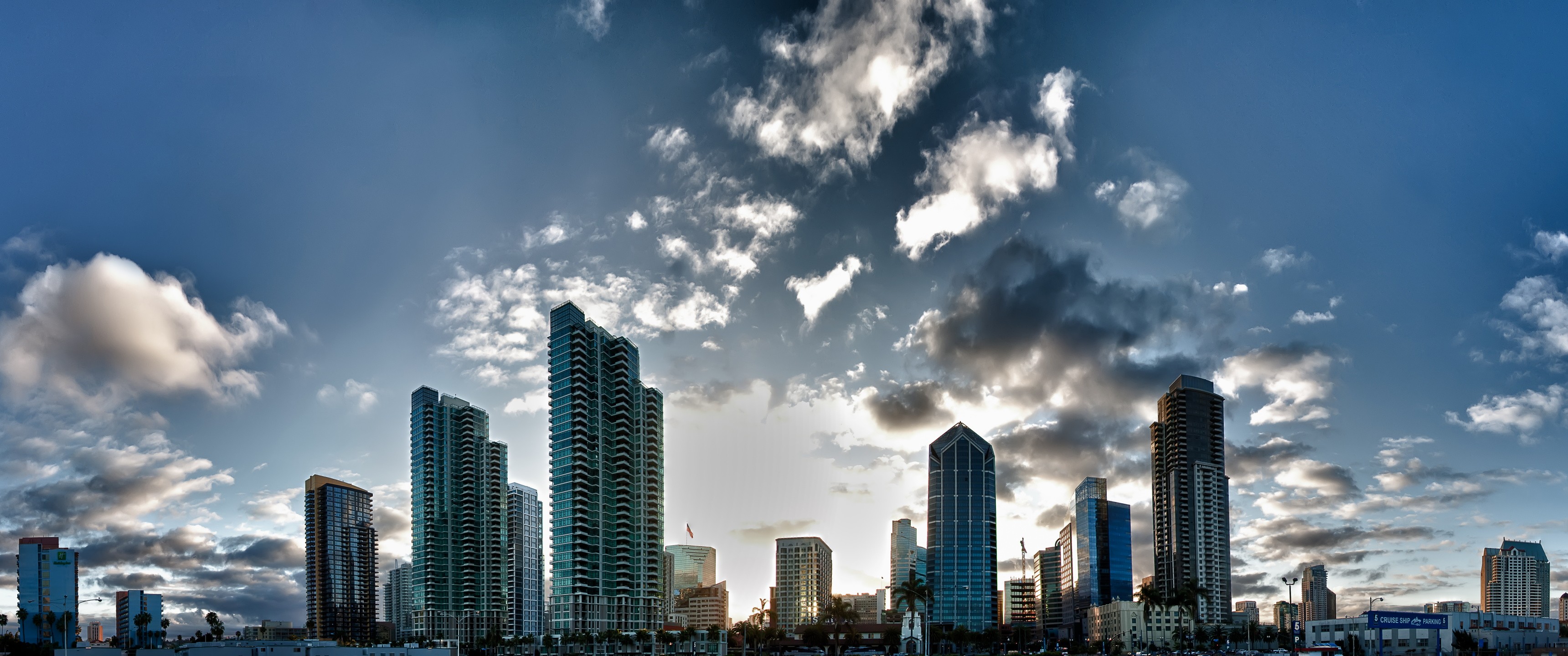 City skyline with skyscrapers and clouds HD Wallpaper