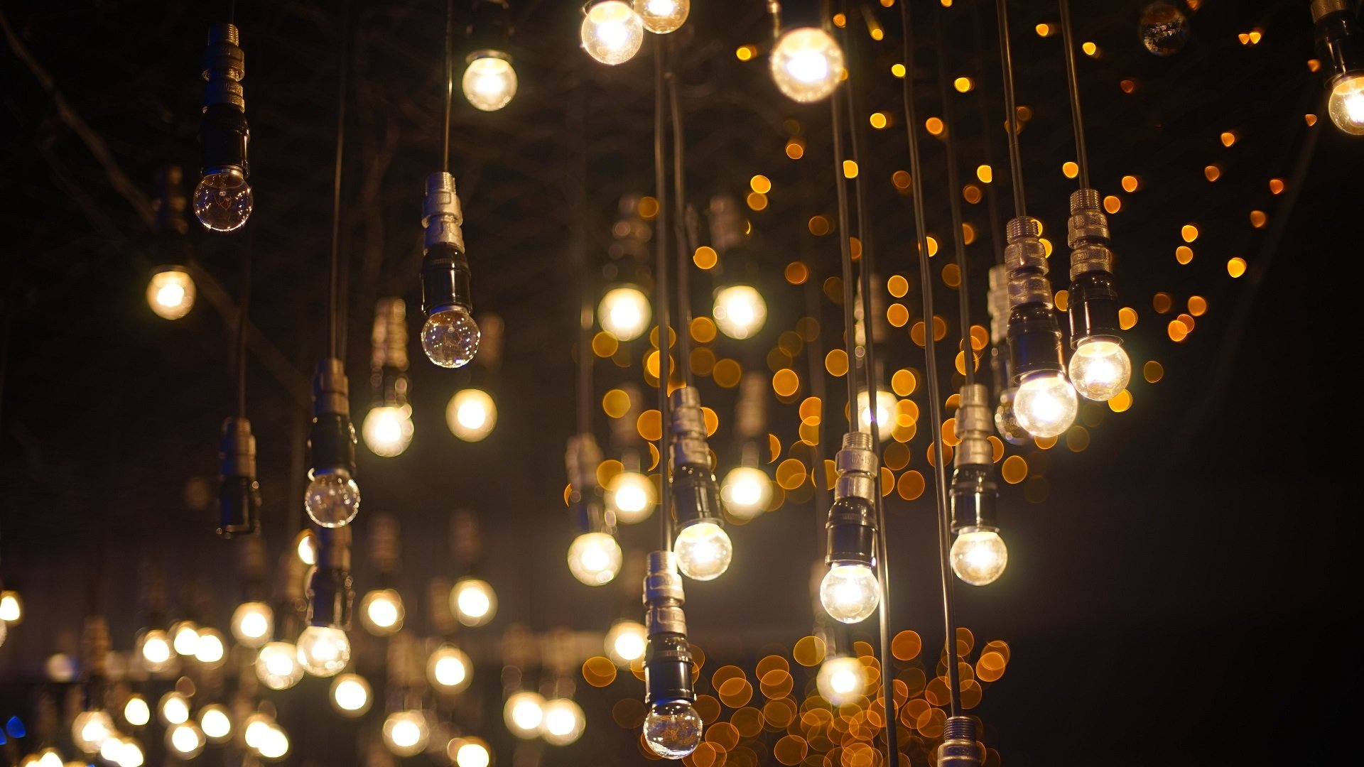 Hanging Edison light bulbs with bokeh background HD Wallpaper