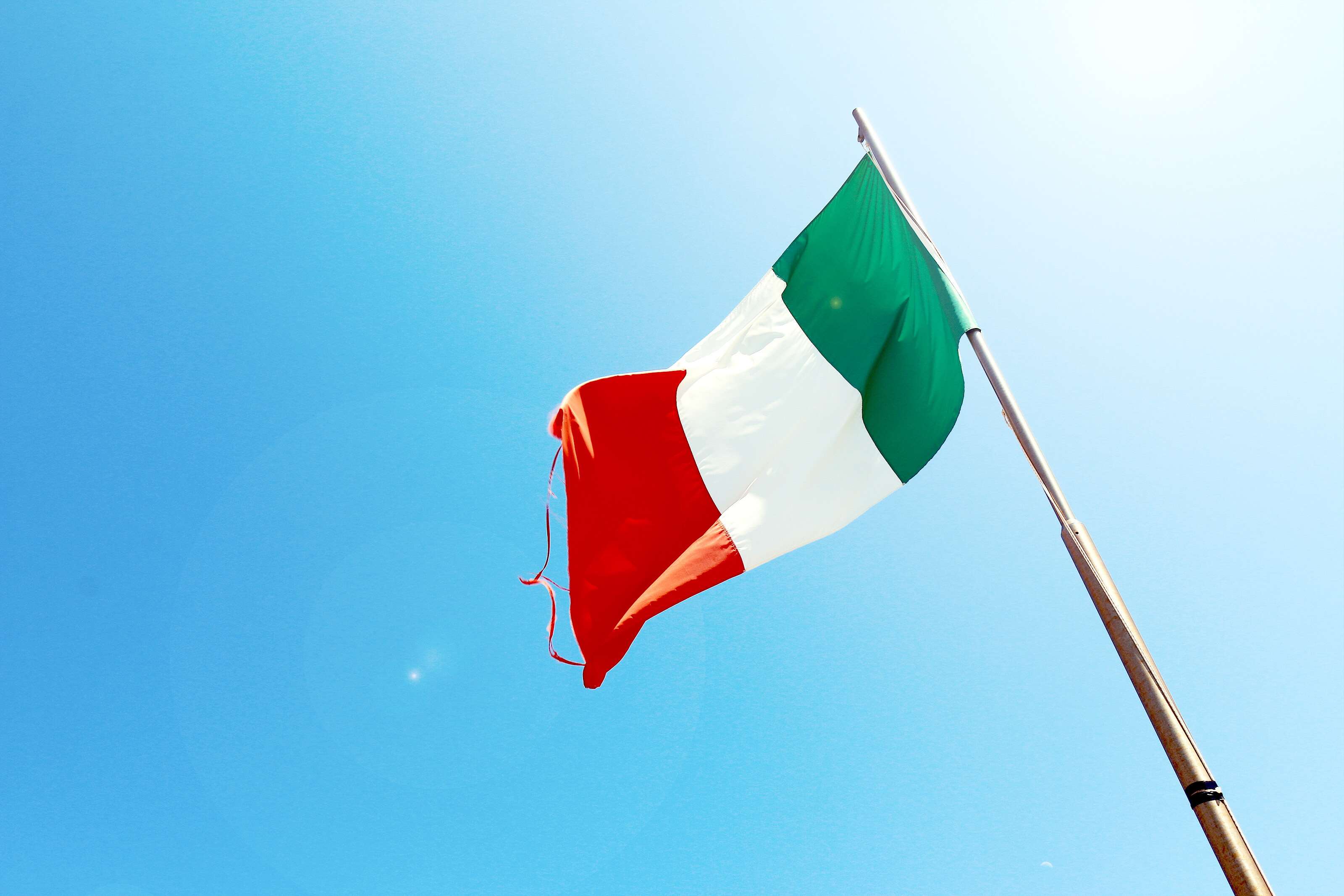 Italian flag waving in the blue sky HD Wallpaper