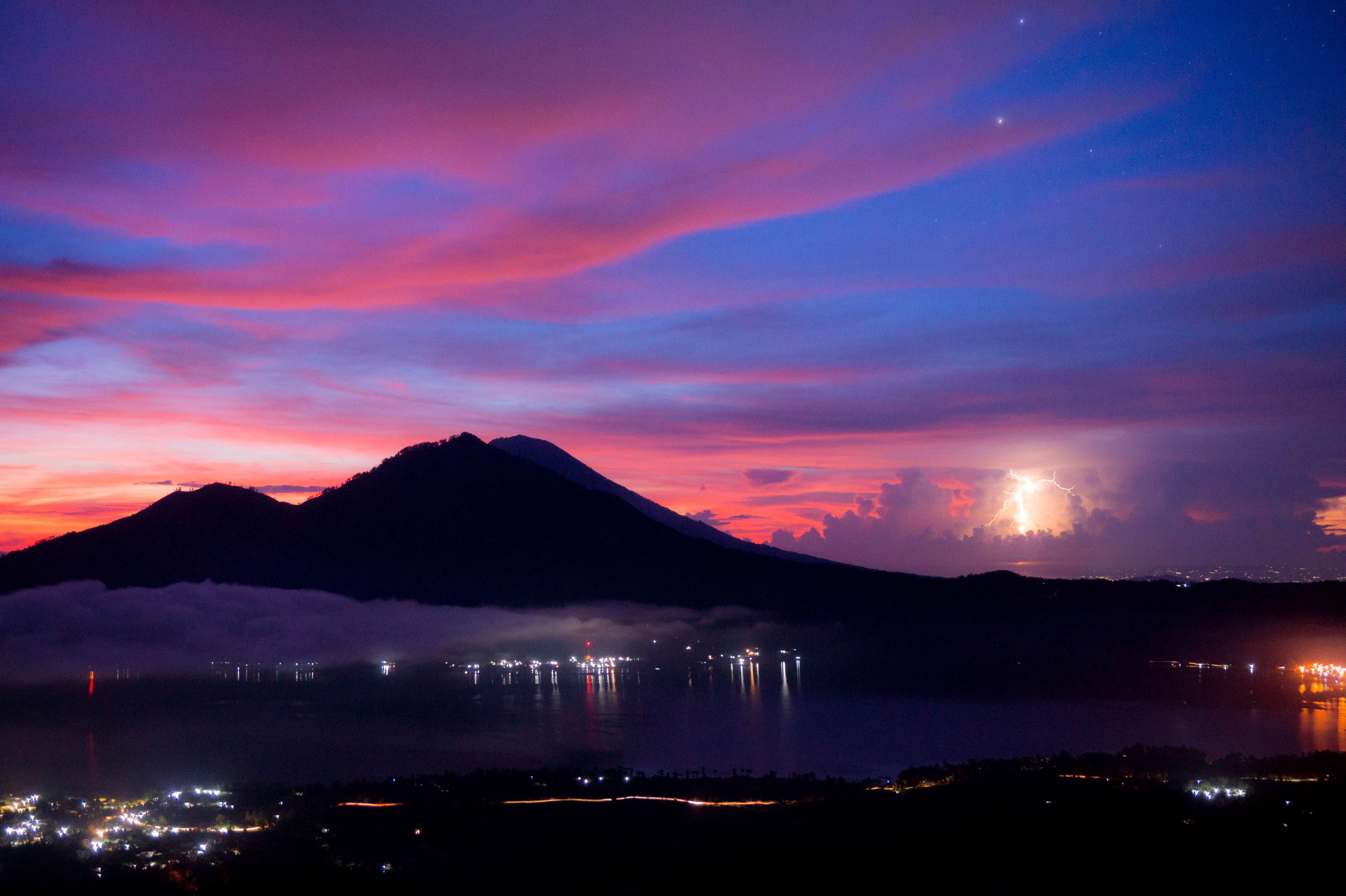Mountains and lake at sunset with lightning HD Wallpaper