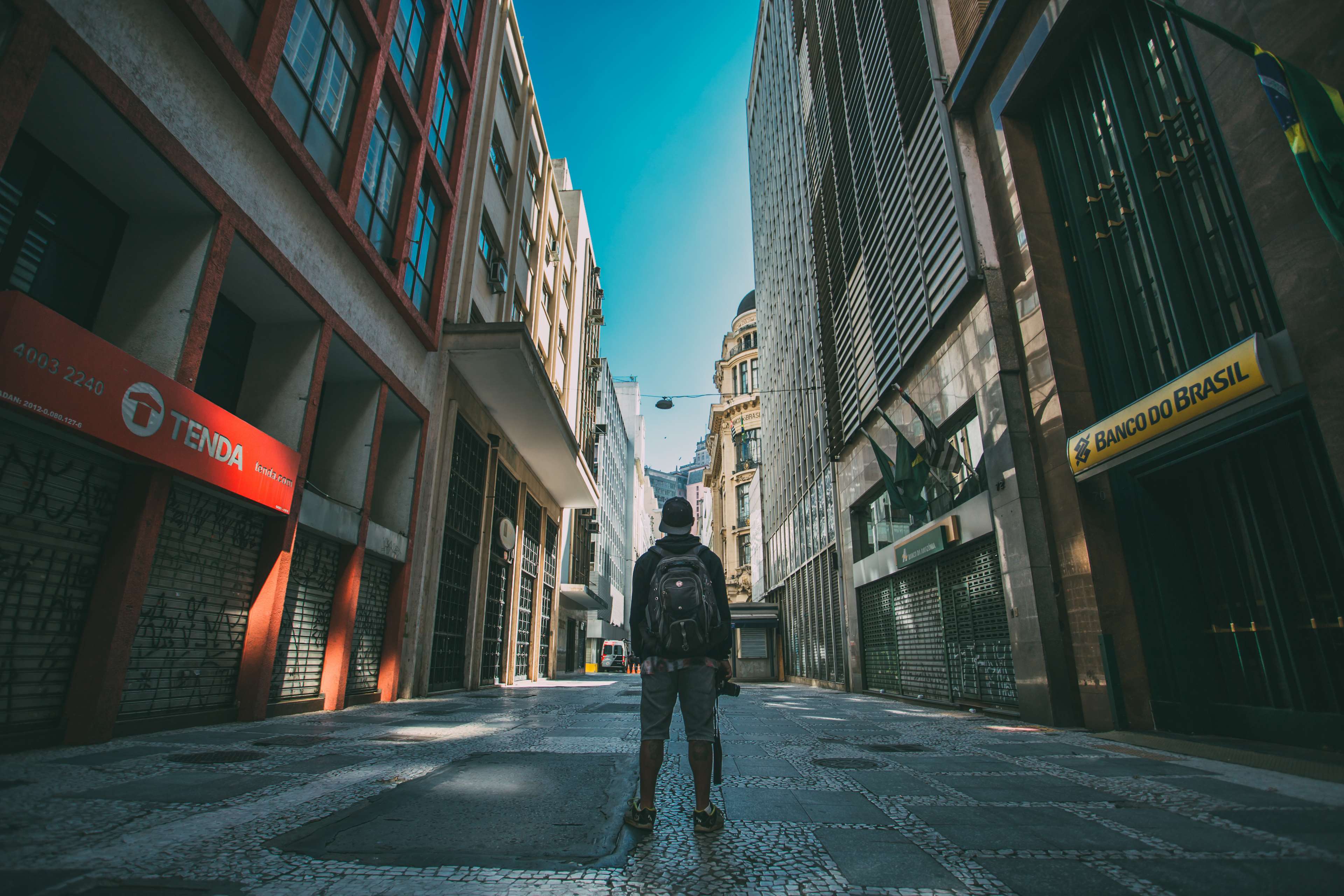 Man with backpack in a street in Brazil 4K HD Wallpaper