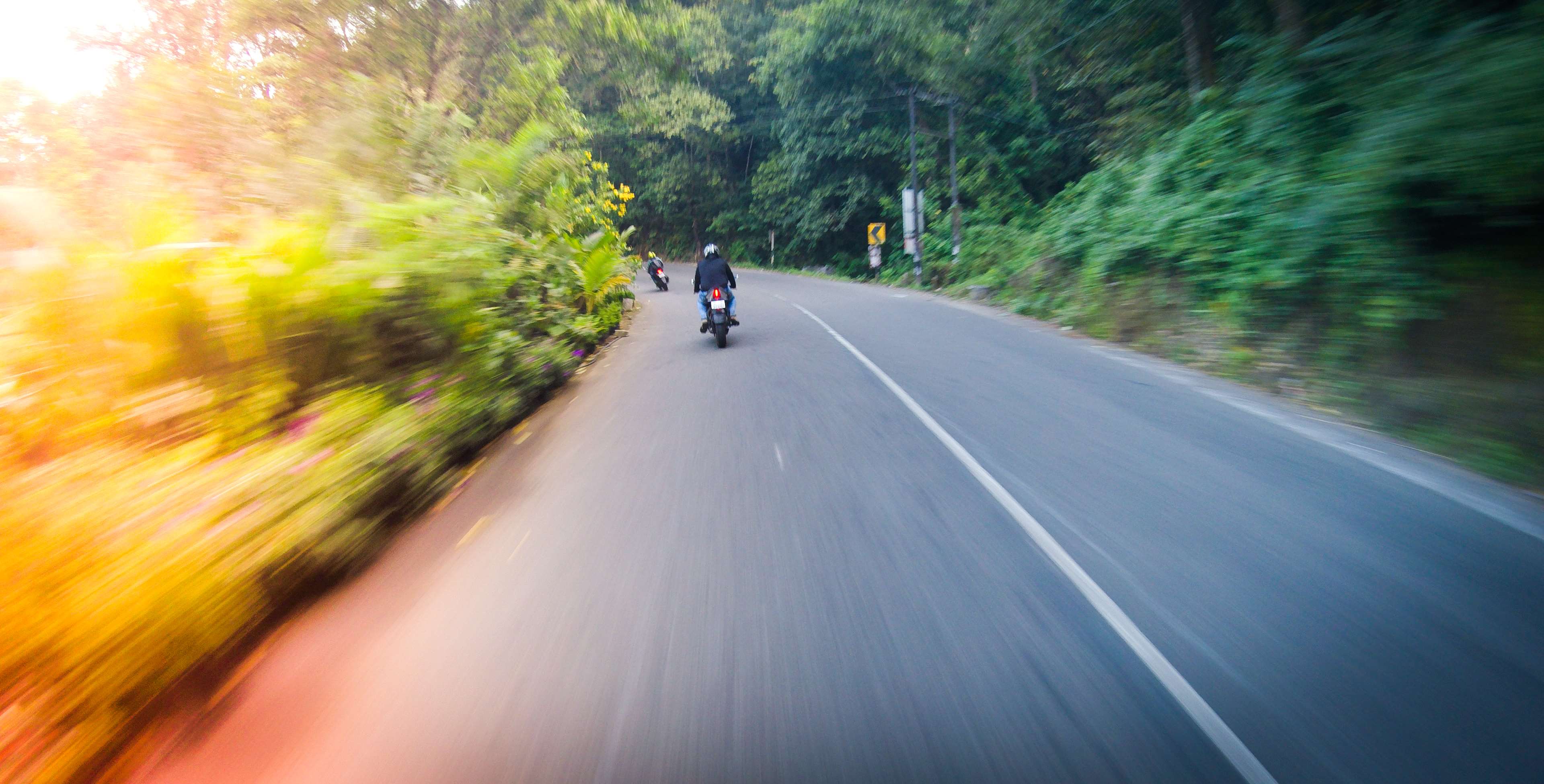 Motorcyclists on a road in Kerala, India 4K HD Wallpaper