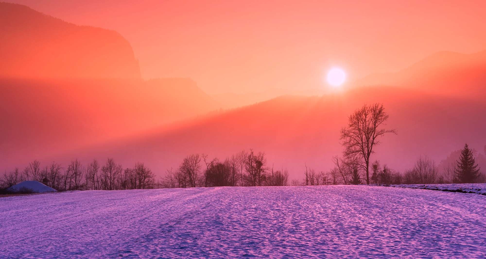 Winter sunrise over a snowy field with mountains HD Wallpaper