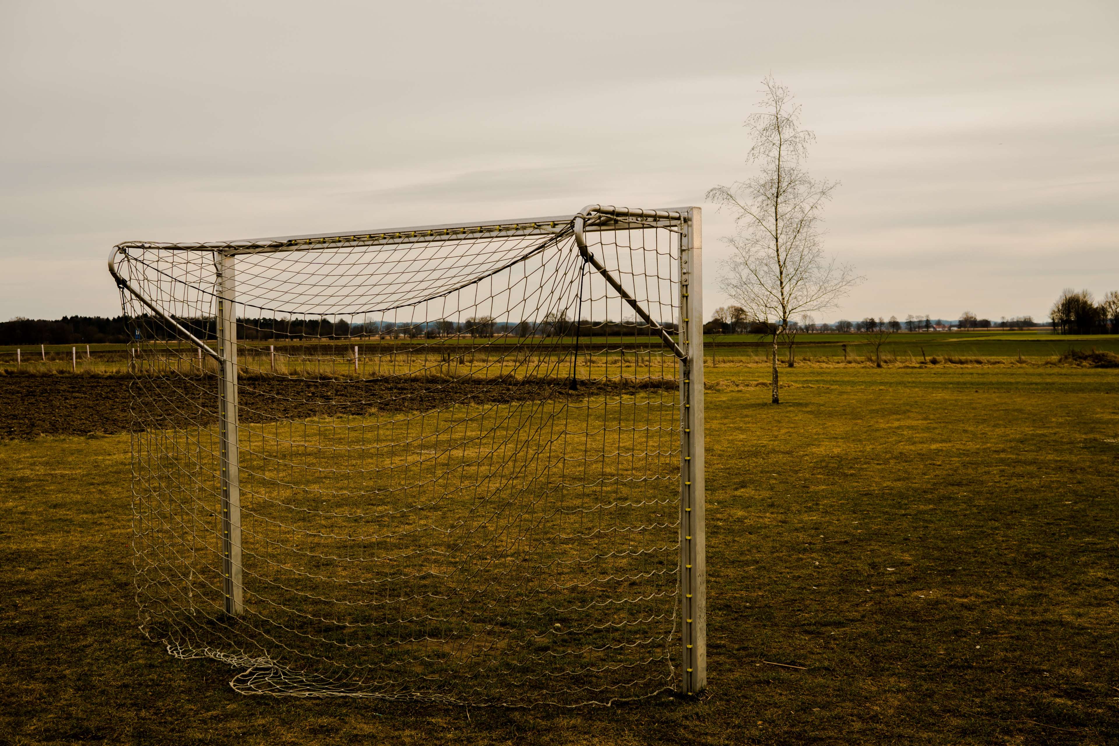 Soccer goal on a grassy field HD Wallpaper