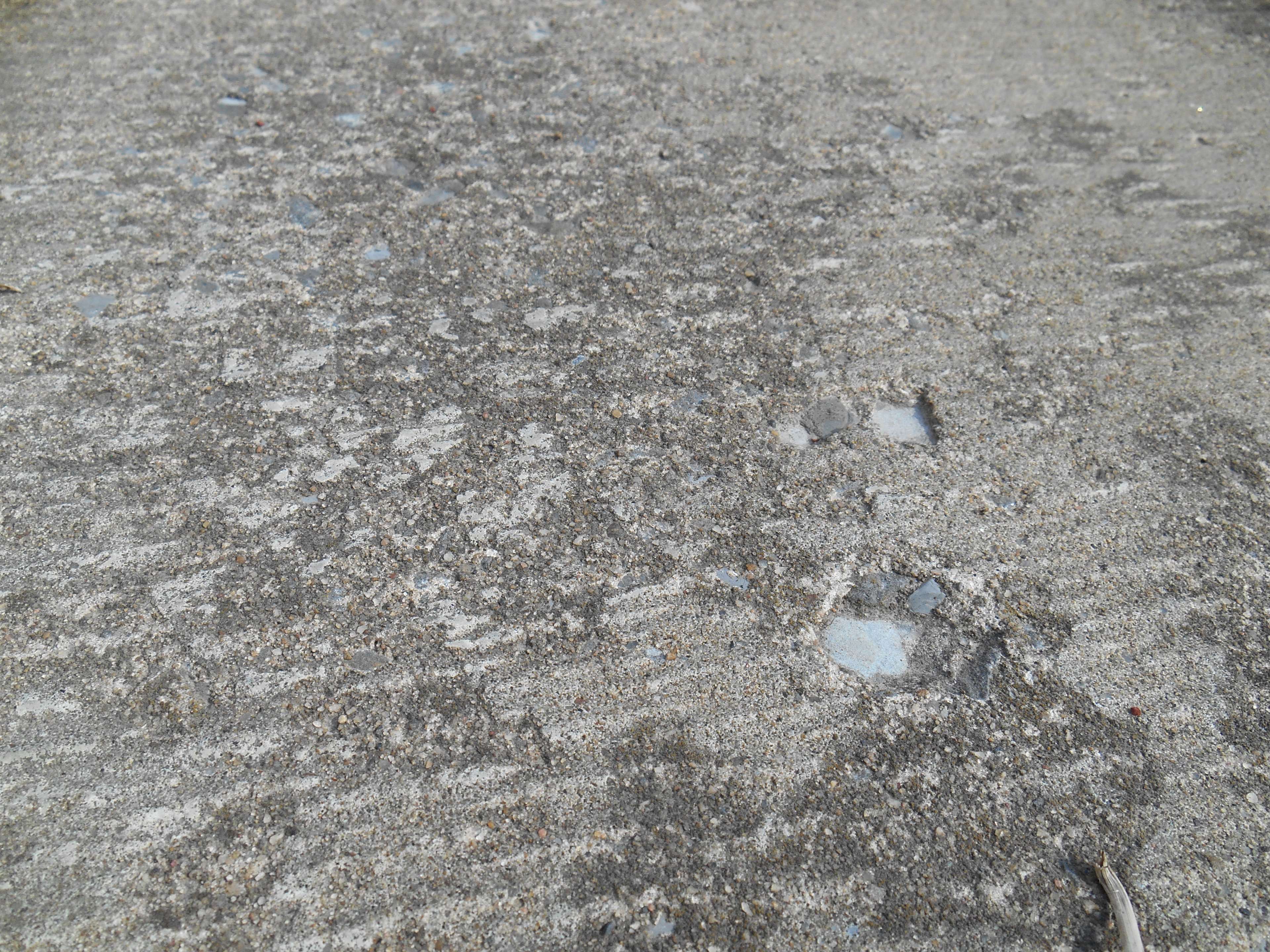 Close-up of a worn and dirty concrete surface HD Wallpaper