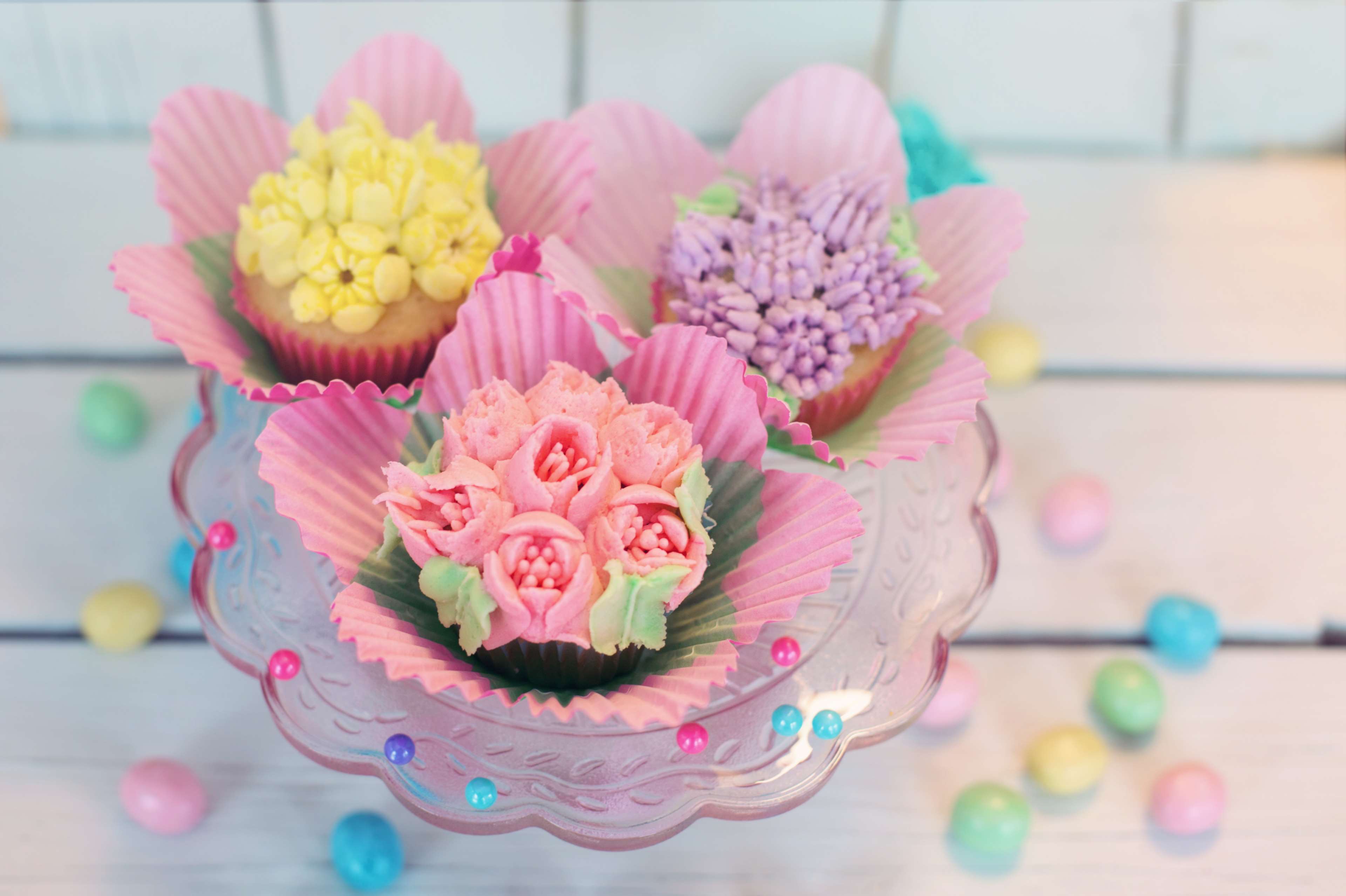 Flower Decorated Cupcakes on a Pink Cake Stand HD Wallpaper