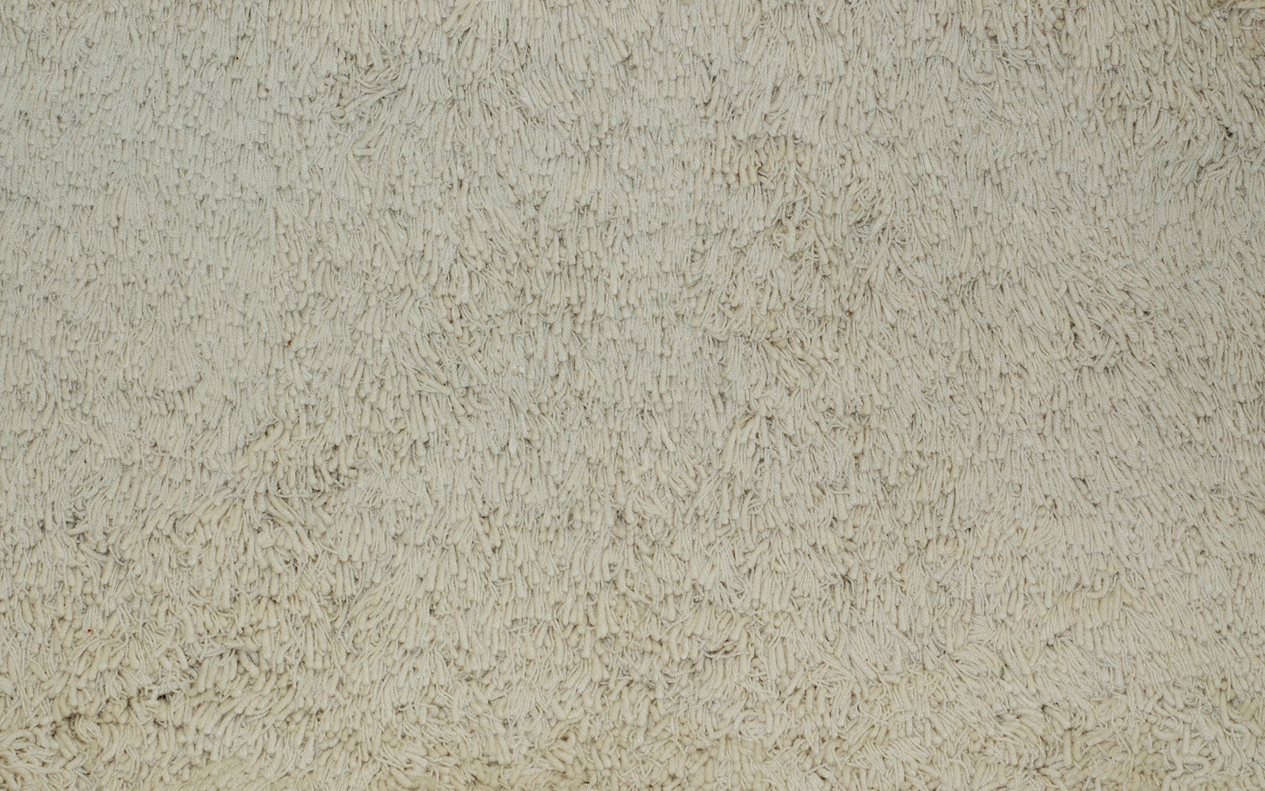 Close-up of a textured beige carpet or rug HD Wallpaper