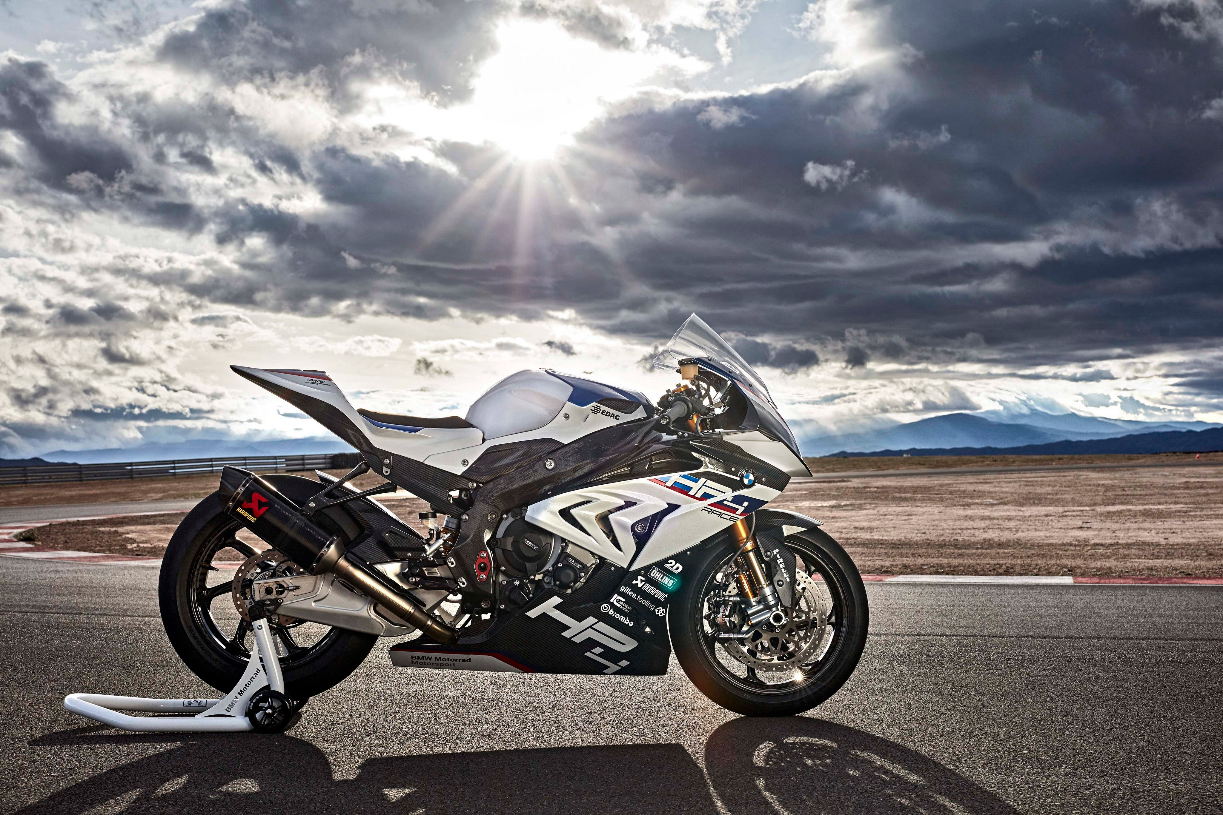 BMW HP4 Race motorcycle on a racetrack HD Wallpaper