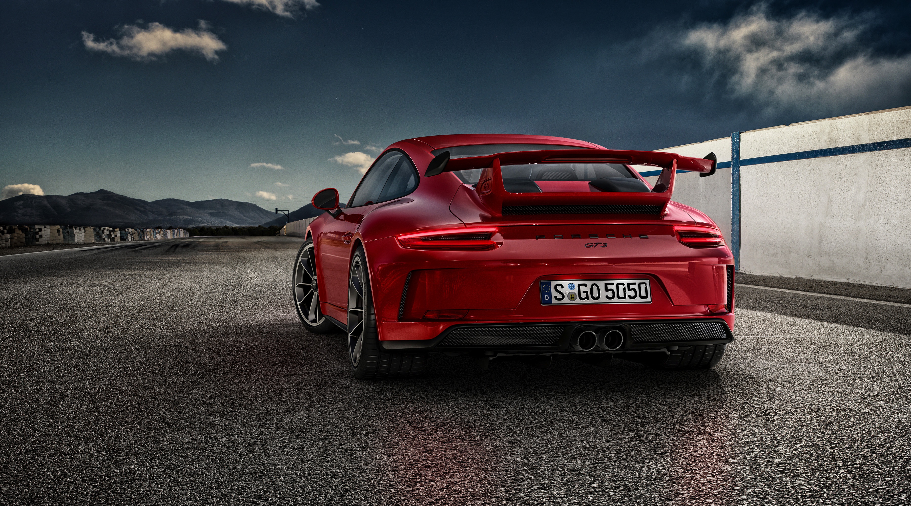 Red Porsche 911 GT3 on a race track HD Wallpaper
