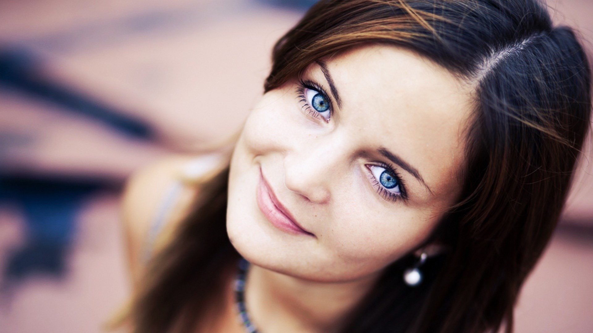 Close-up of a young woman with blue eyes HD Wallpaper