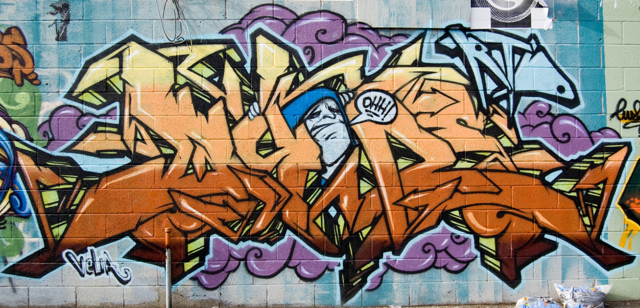 Graffiti art with cartoon character on brick wall HD Wallpaper