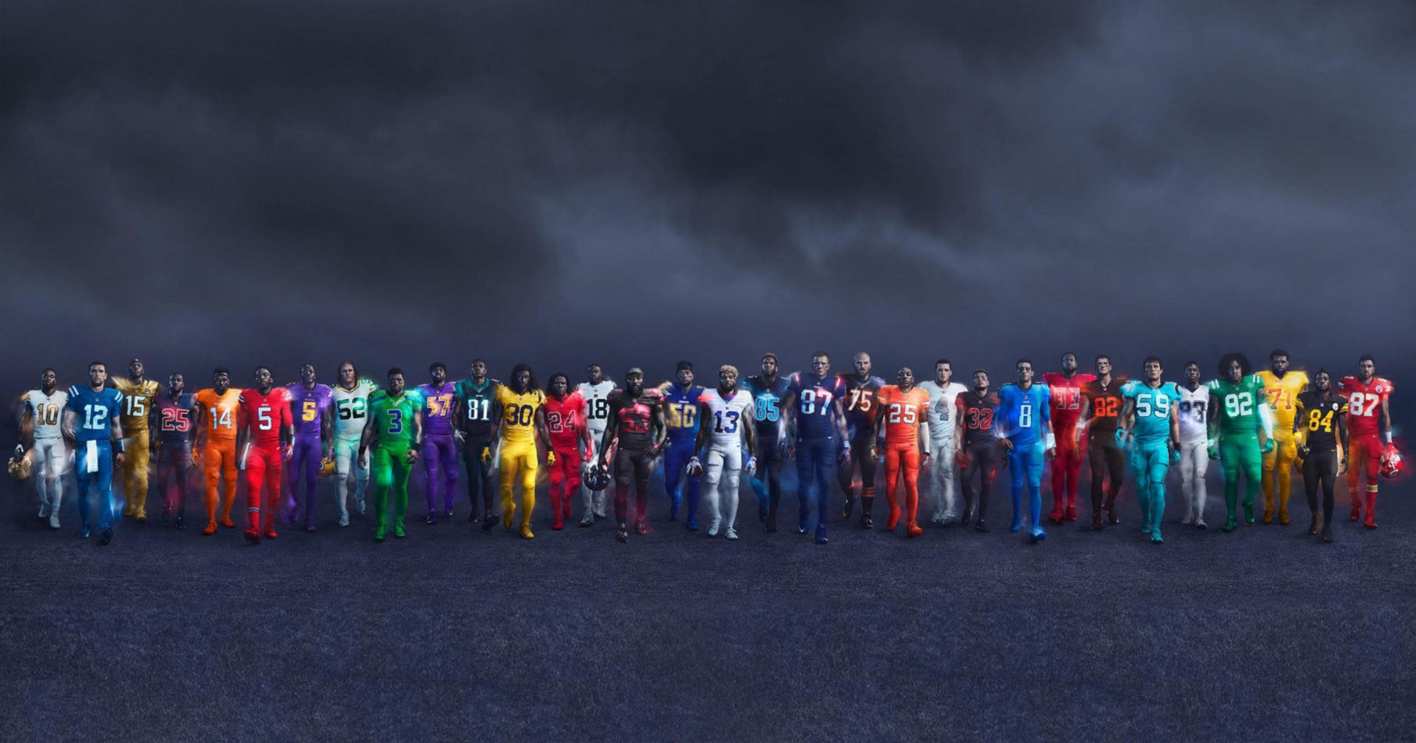 NFL players in colorful uniforms standing in a line HD Wallpaper