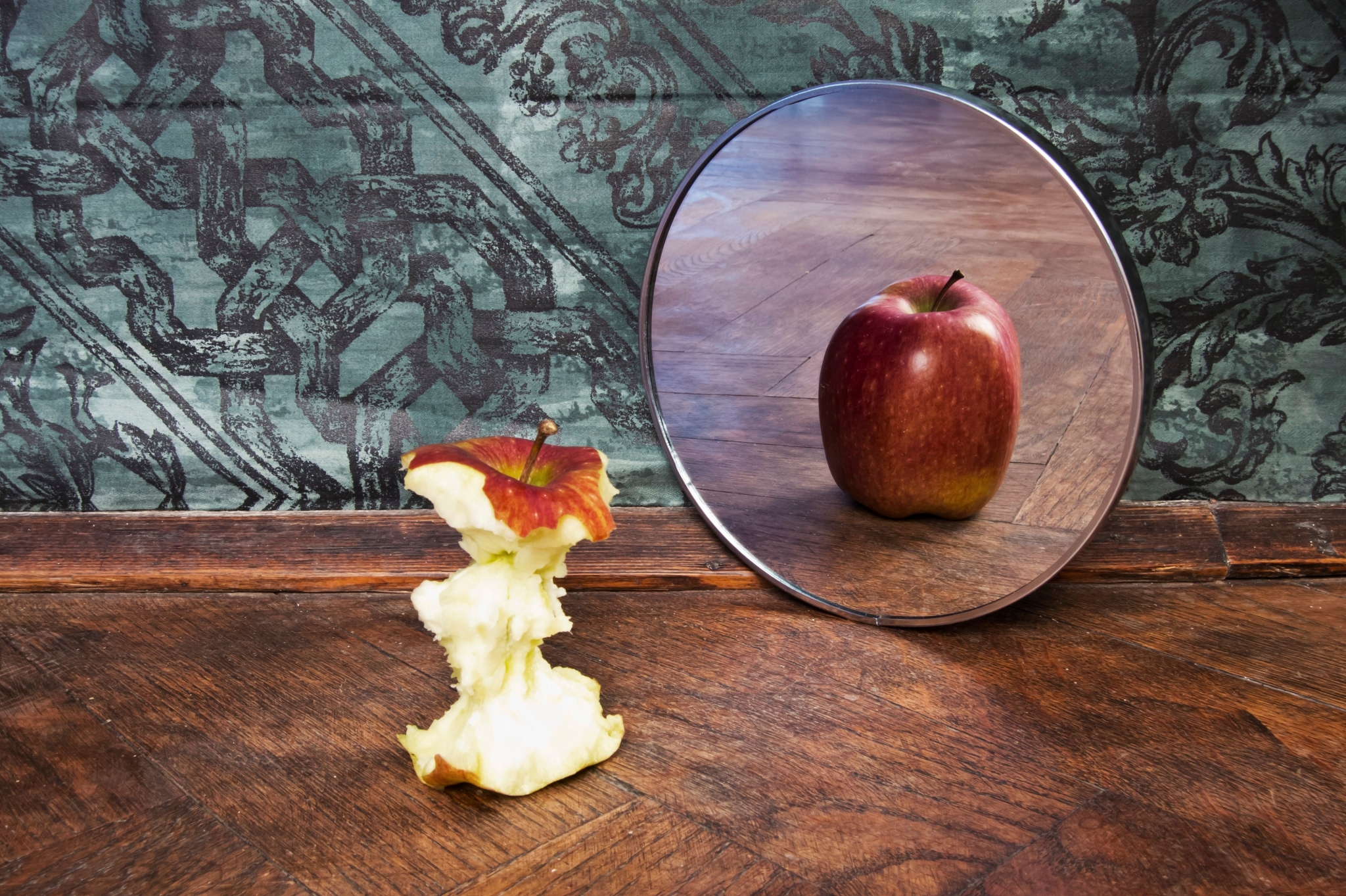 Apple core and reflection in mirror HD Wallpaper