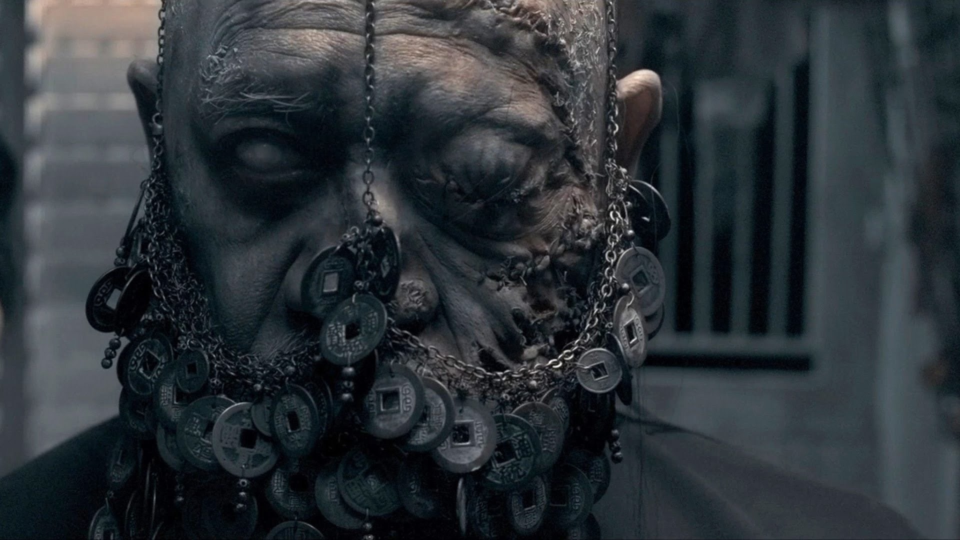 Close-up of a grotesque man with coins in his beard HD Wallpaper