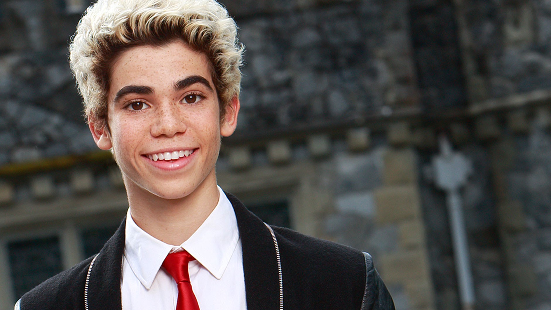 Cameron Boyce smiling in a suit HD Wallpaper
