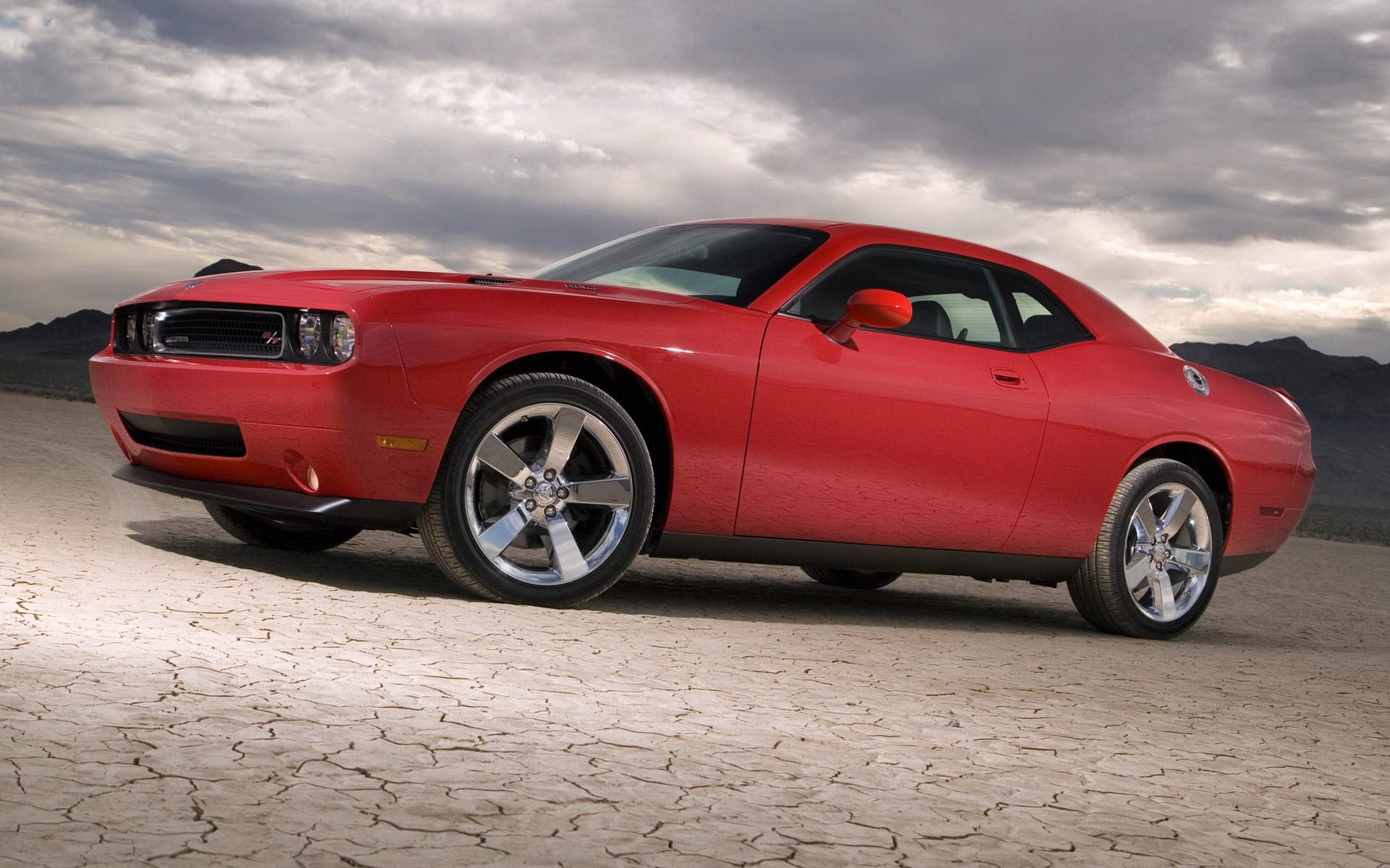 Red Dodge Challenger in a Desert Landscape HD Wallpaper