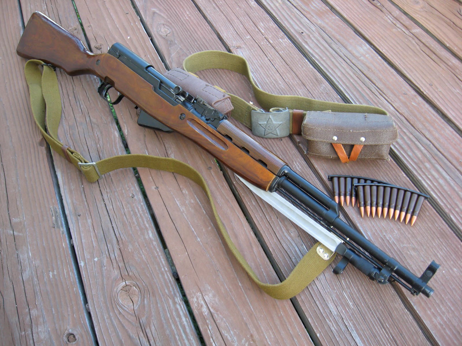 SKS rifle with bayonet, ammunition, and belt pouch HD Wallpaper