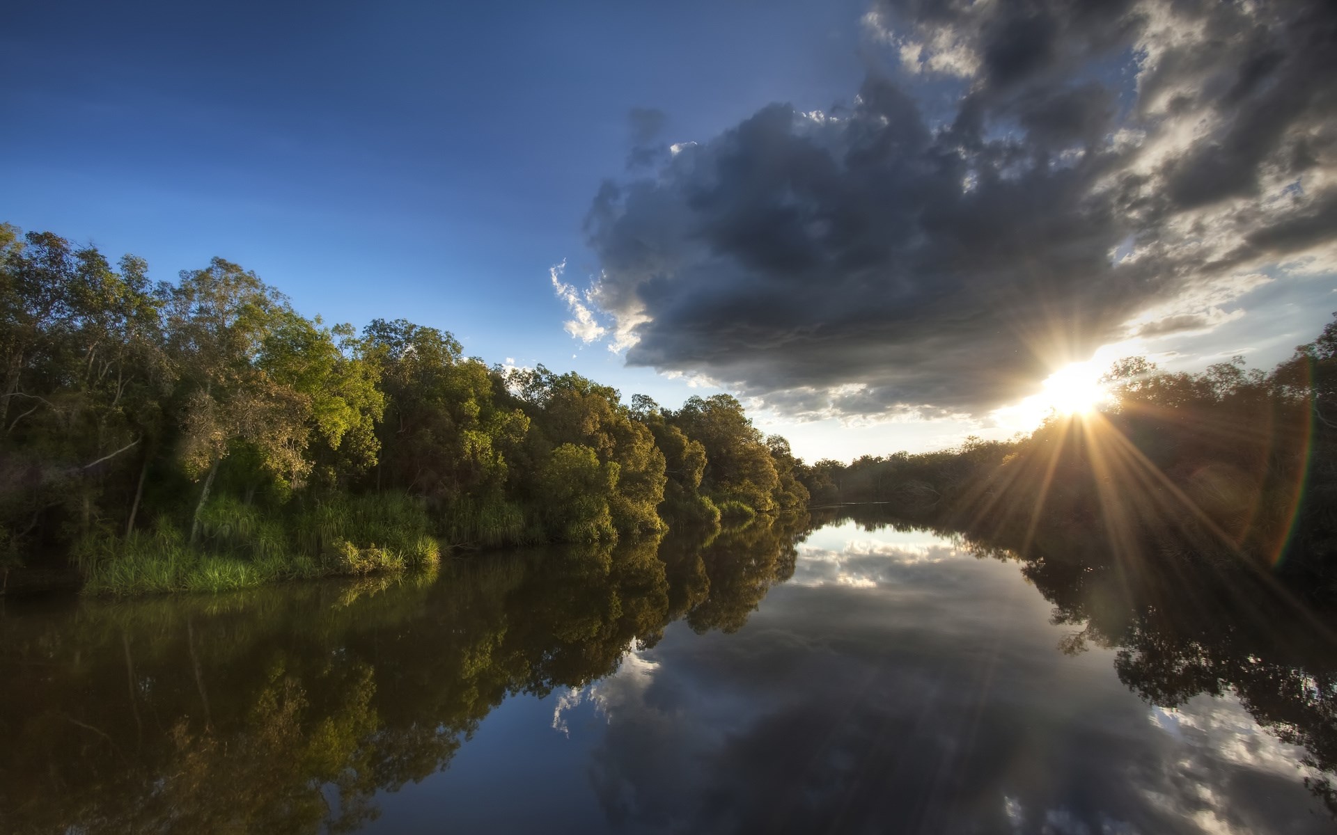 River reflecting trees and sunset with dramatic clouds HD Wallpaper