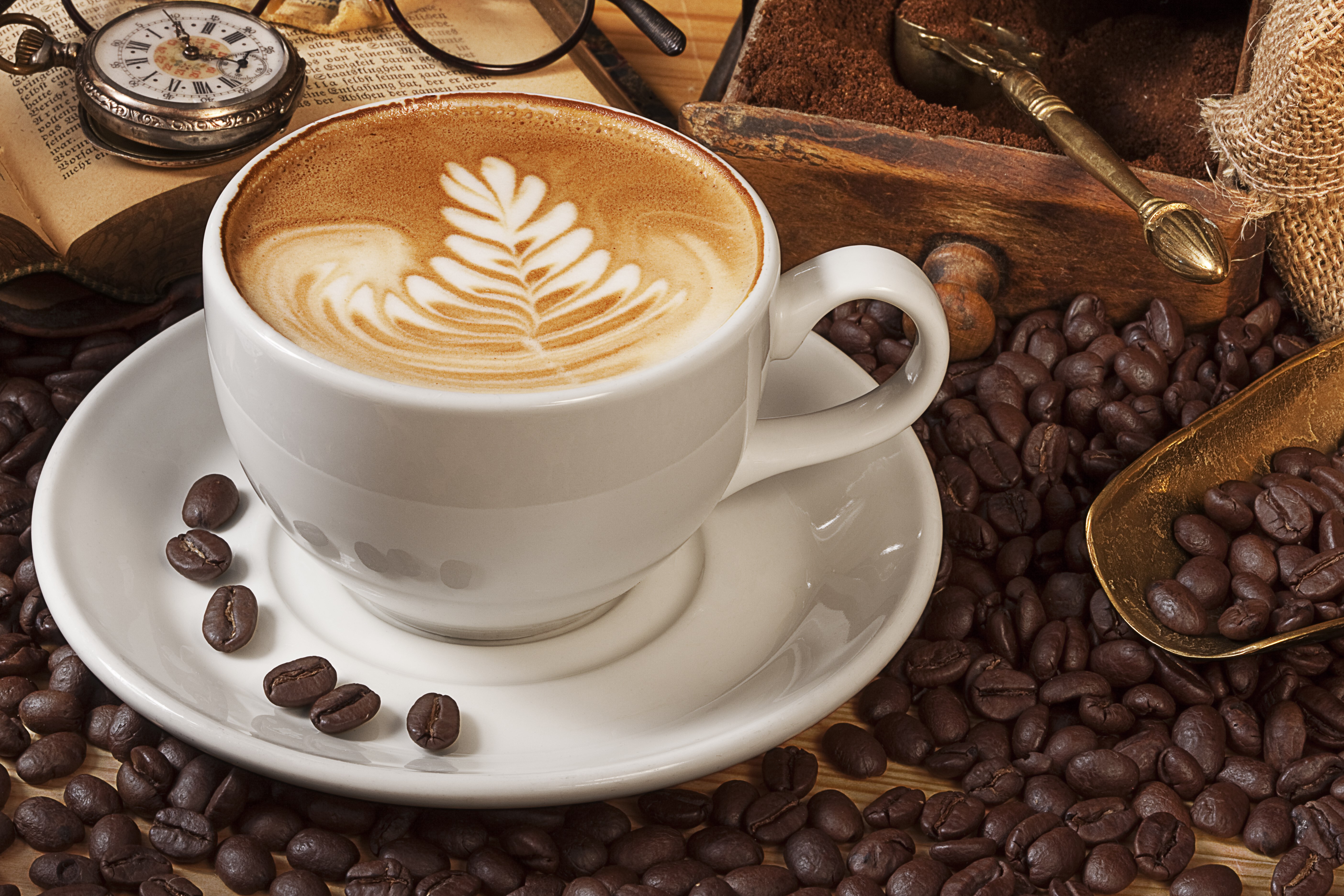 Latte art coffee cup with coffee beans and vintage items HD Wallpaper