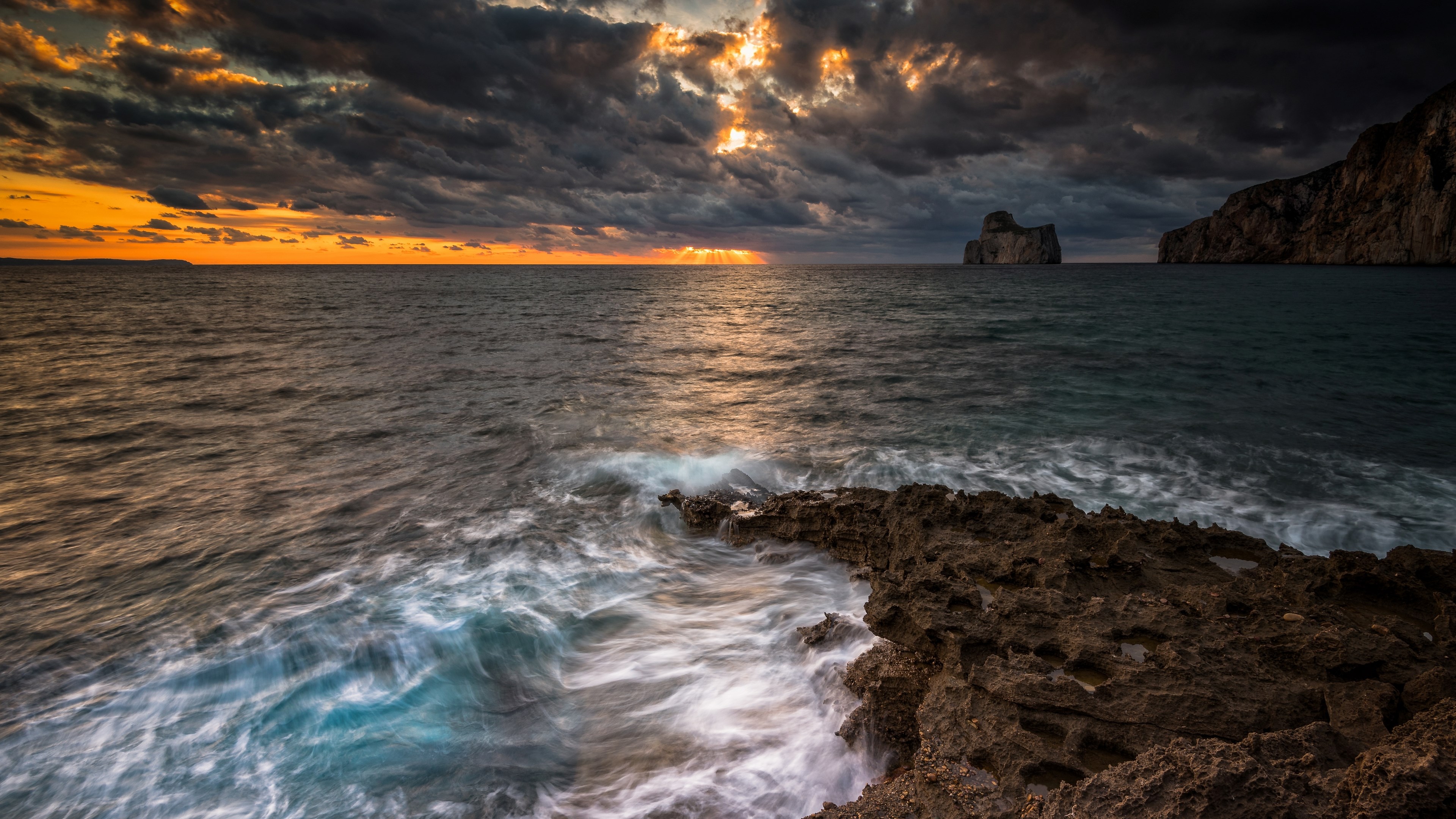 4K Sunset Over Rocky Coastline with Sea Stacks HD Wallpaper