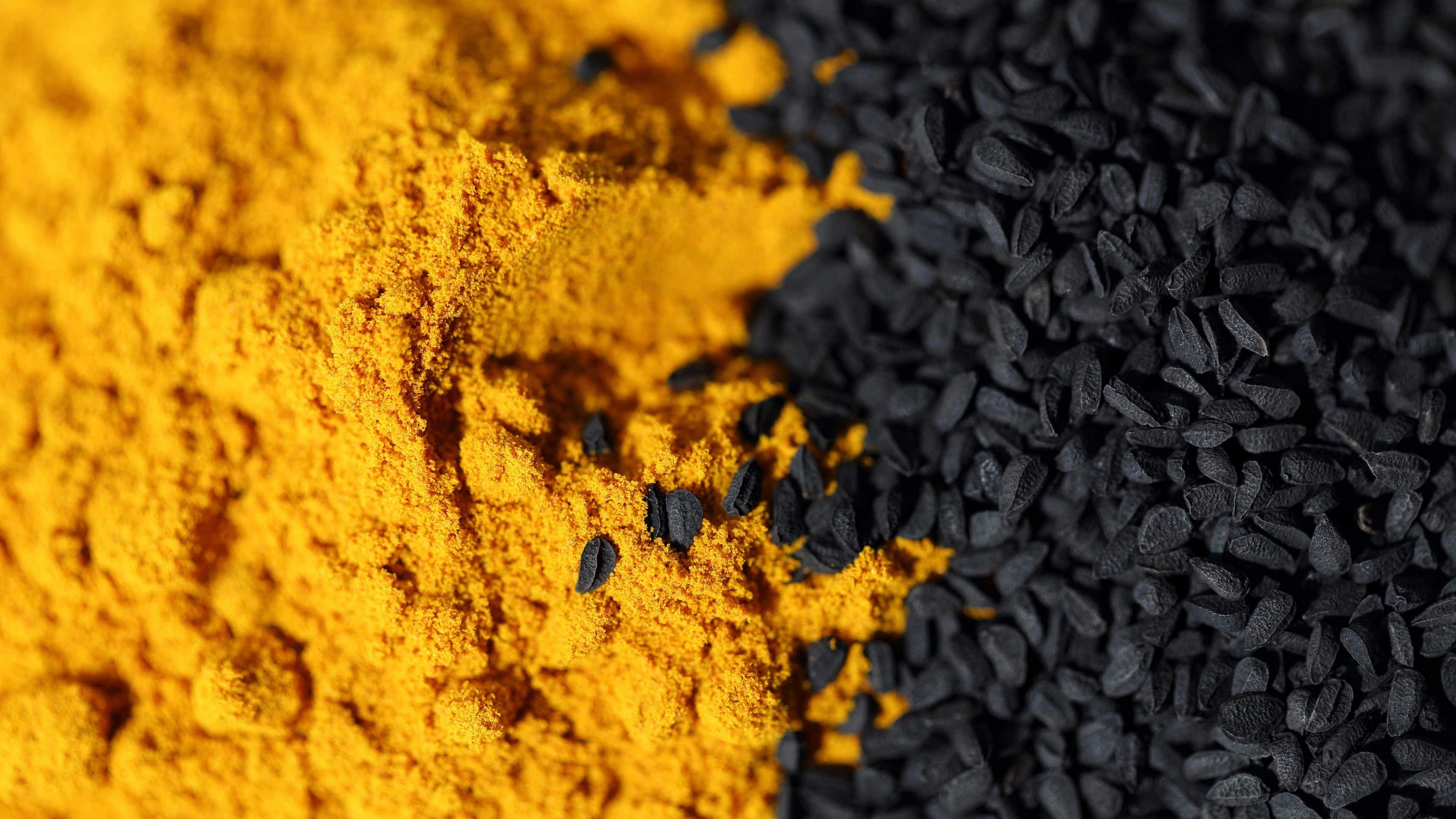 4K Turmeric Powder and Black Seeds HD Wallpaper