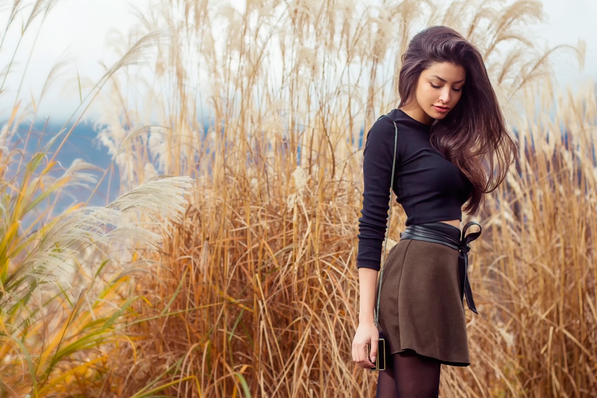 Young Woman Standing in Autumn Field HD Wallpaper