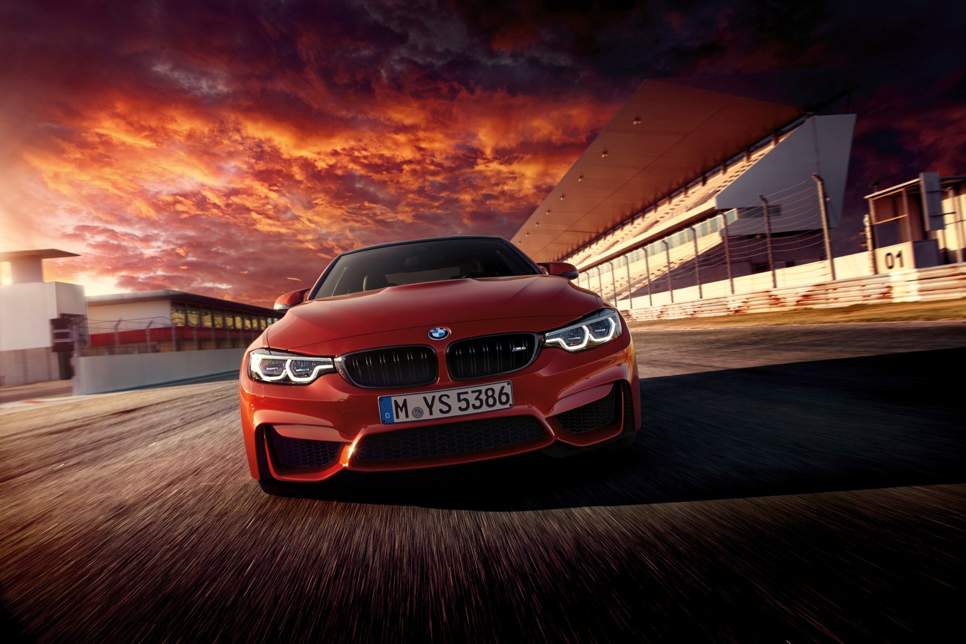 Red BMW M4 on a Race Track at Sunset HD Wallpaper