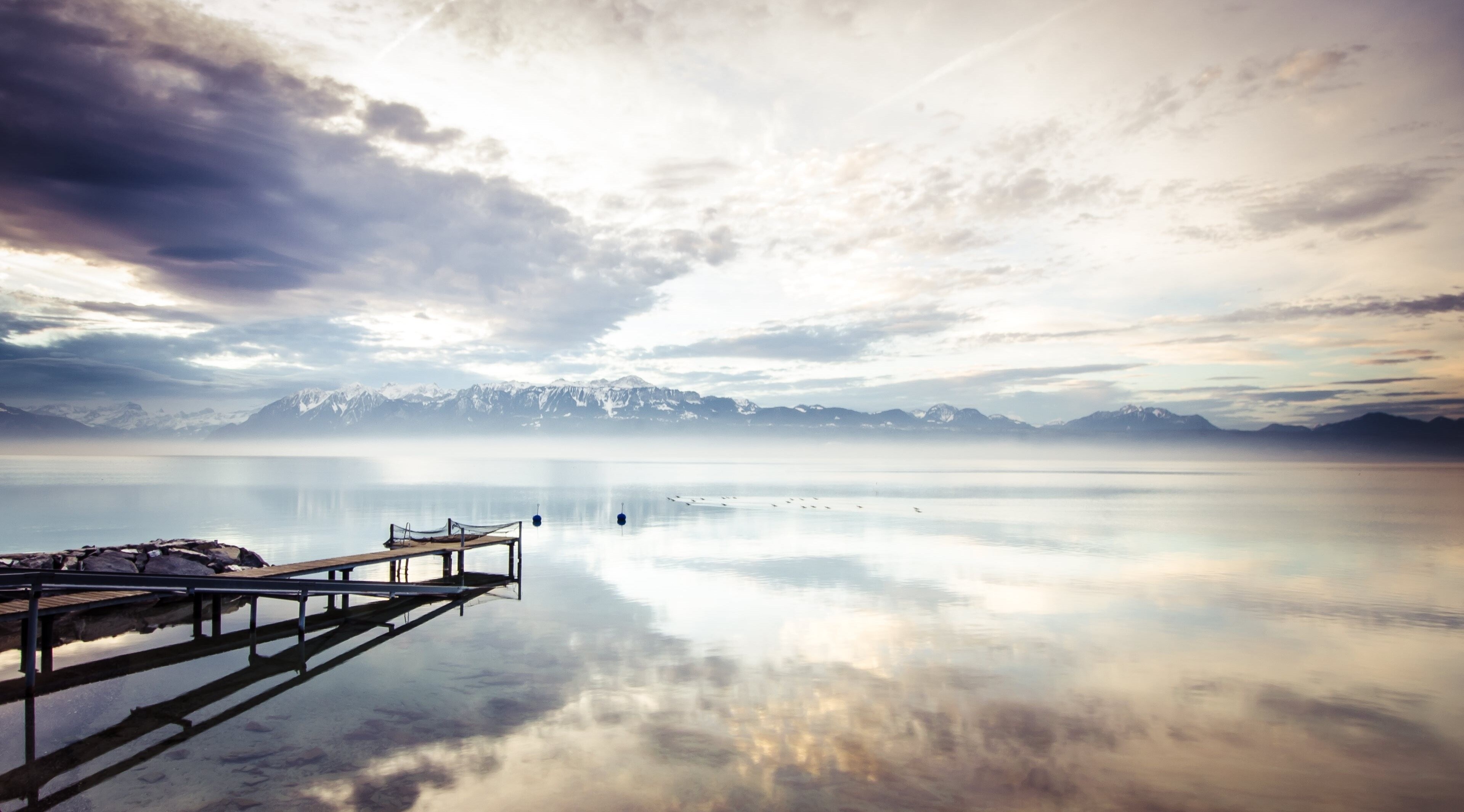 Lake with mountains and a pier HD Wallpaper