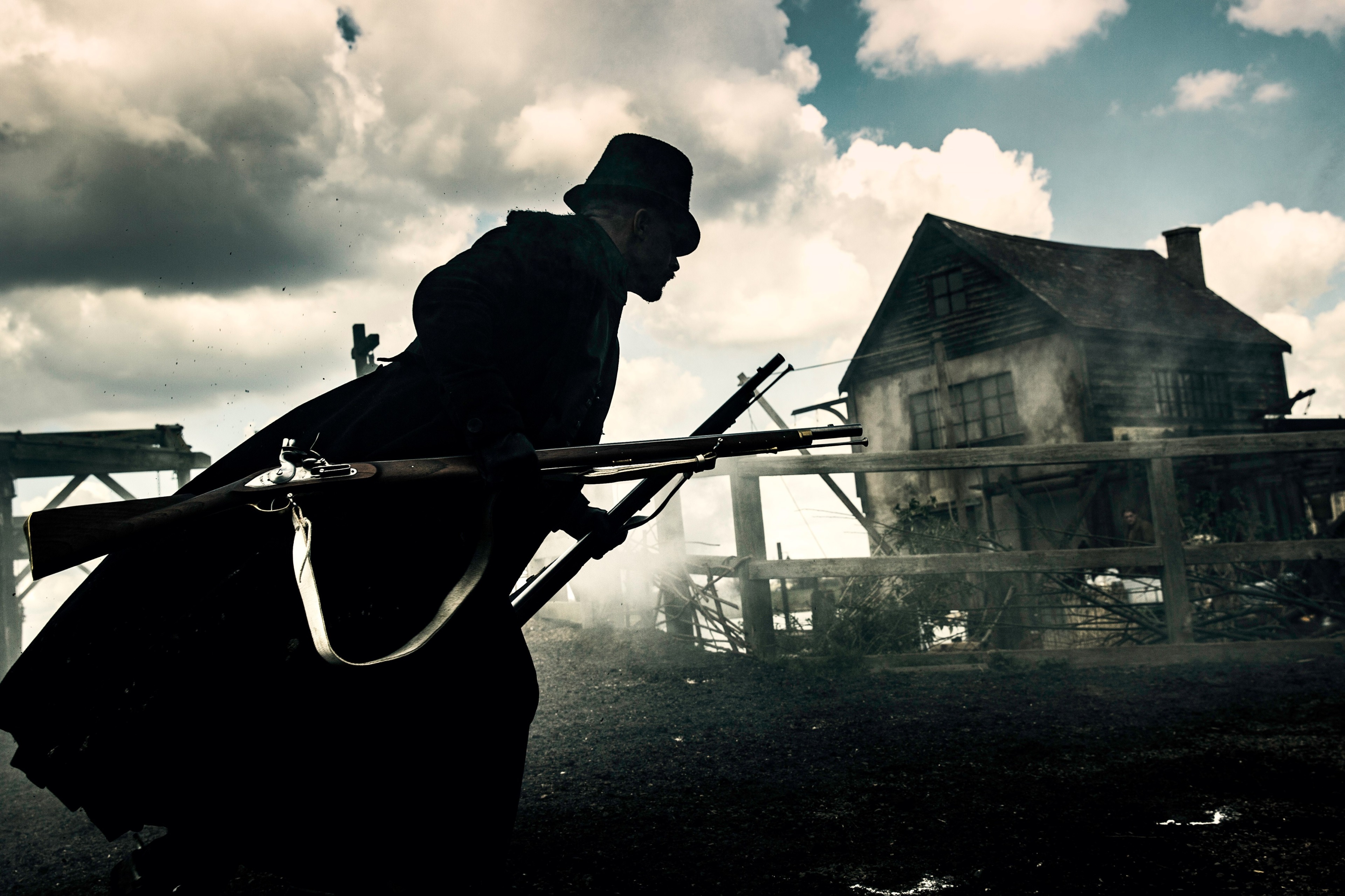 Man with rifle in front of dilapidated house HD Wallpaper