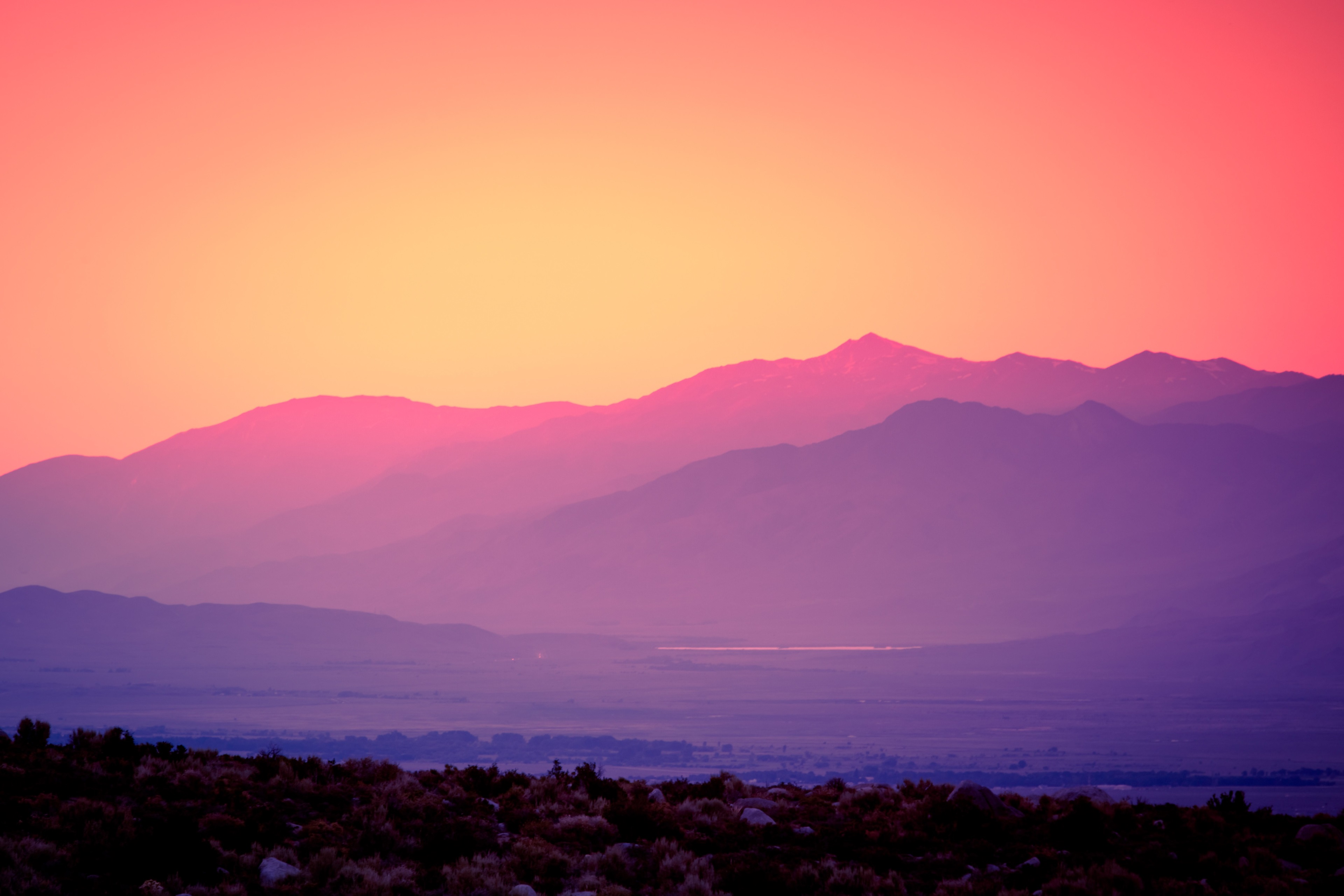 Sunset over layered mountains and desert HD Wallpaper