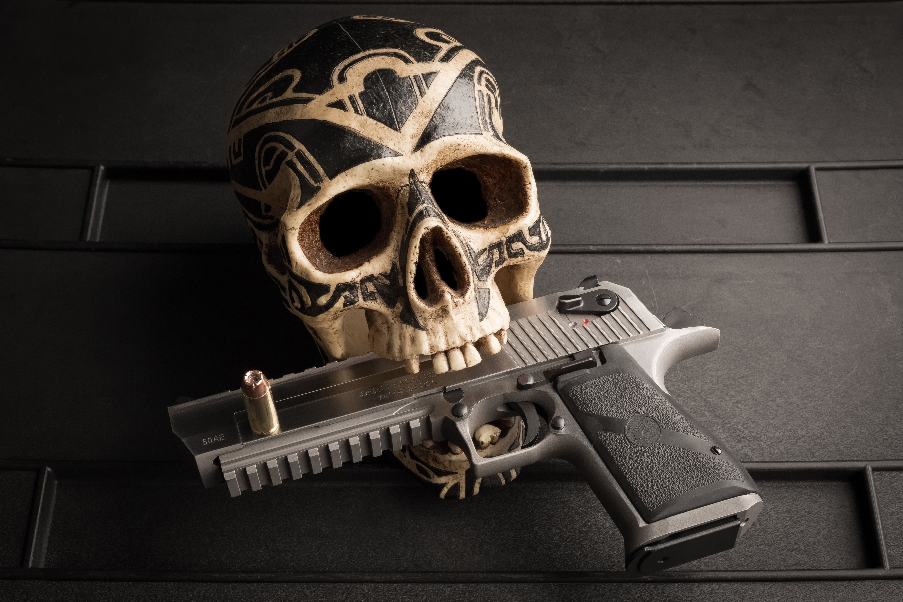 Skull with a gun and bullet HD Wallpaper
