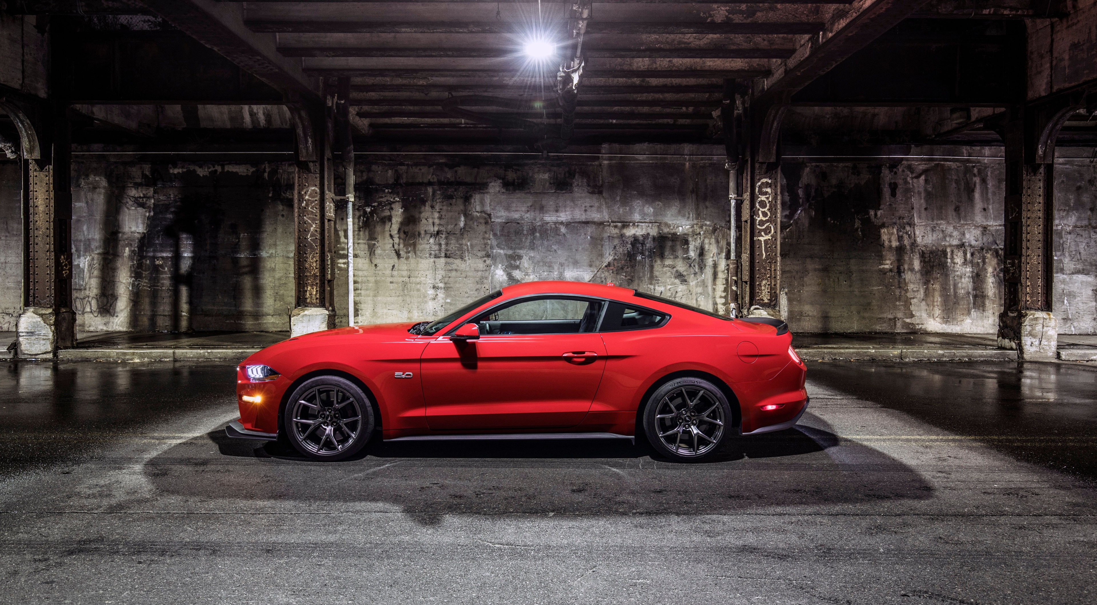 Red Ford Mustang 5.0 parked under bridge HD Wallpaper