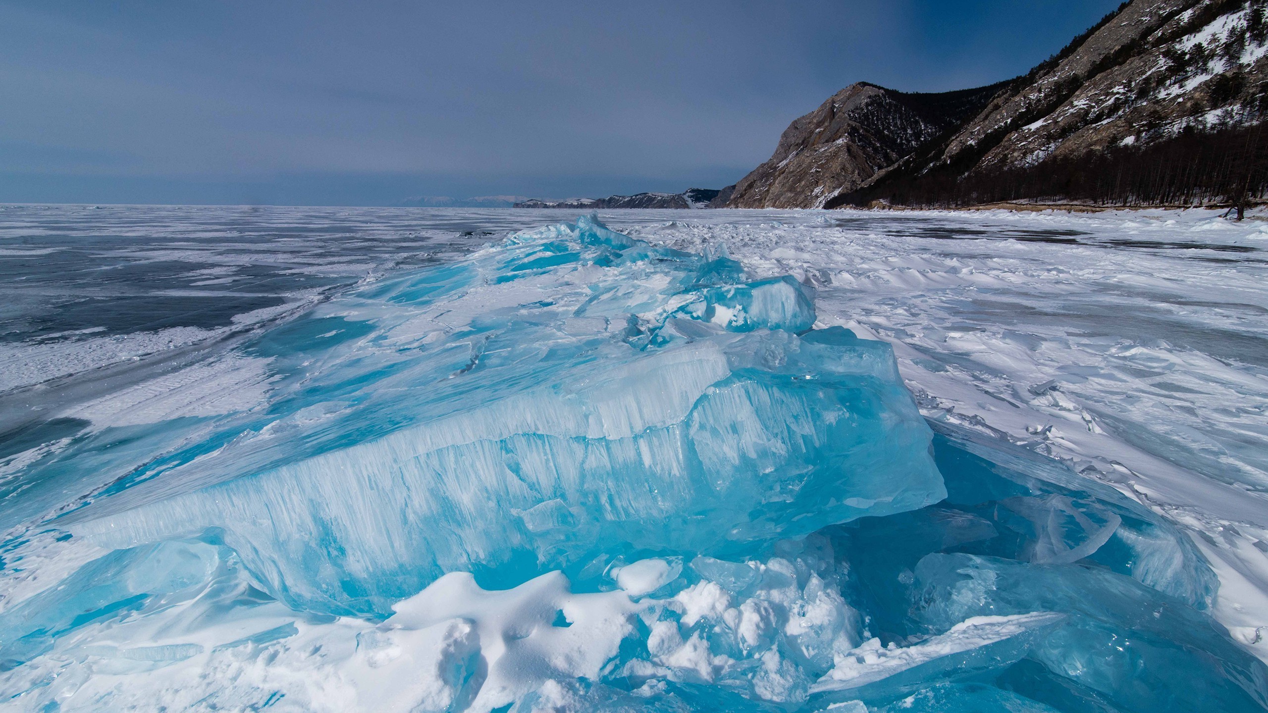 Frozen Lake Baikal with Ice Formations and Mountains HD Wallpaper