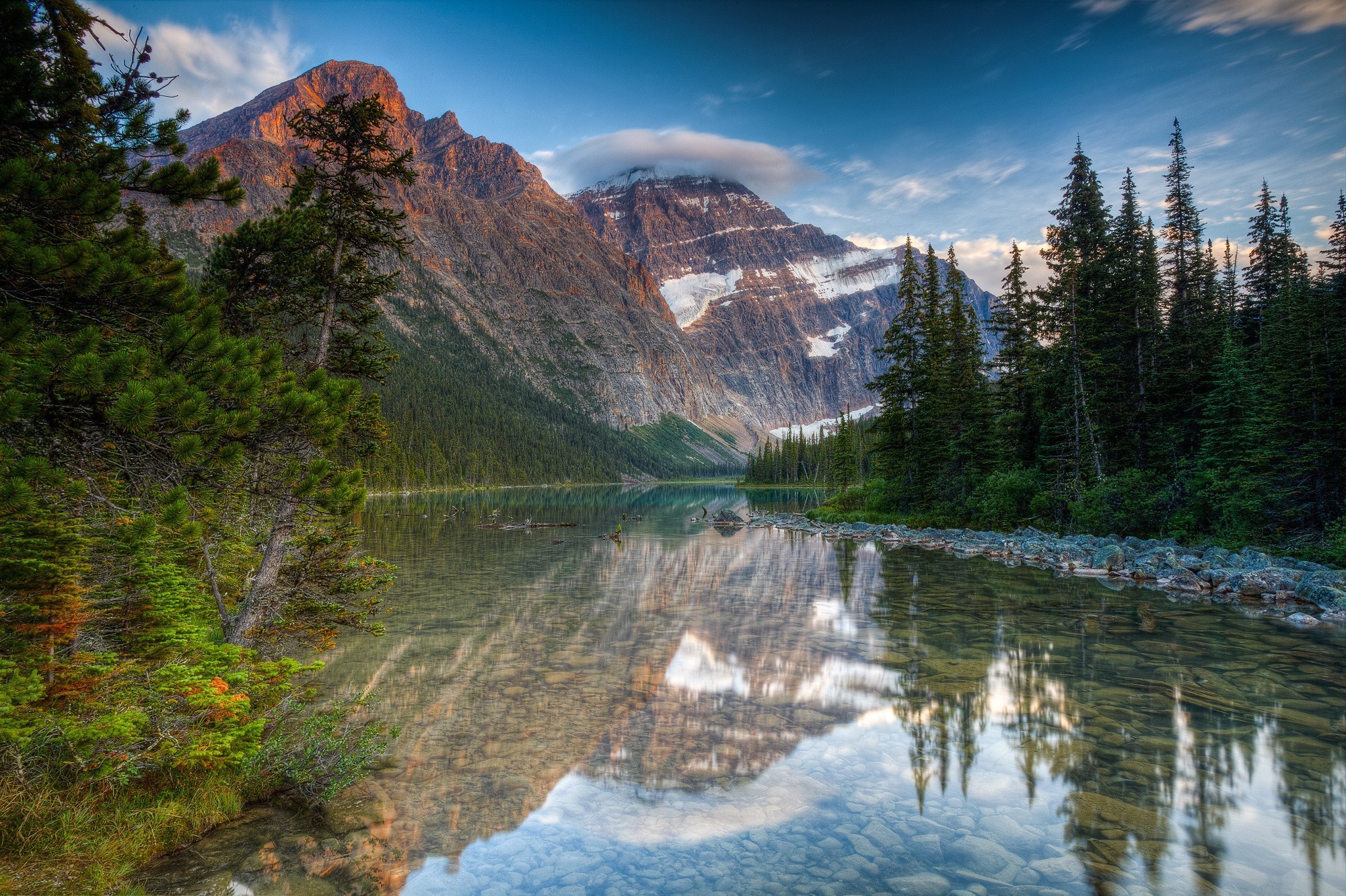 Mountain Landscape with Reflective River and Pine Trees HD Wallpaper