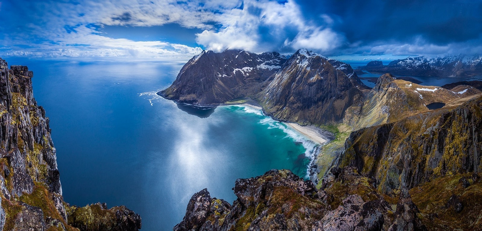 Mountainous coastline with a beach and the sea in Lofoten, Norway HD Wallpaper