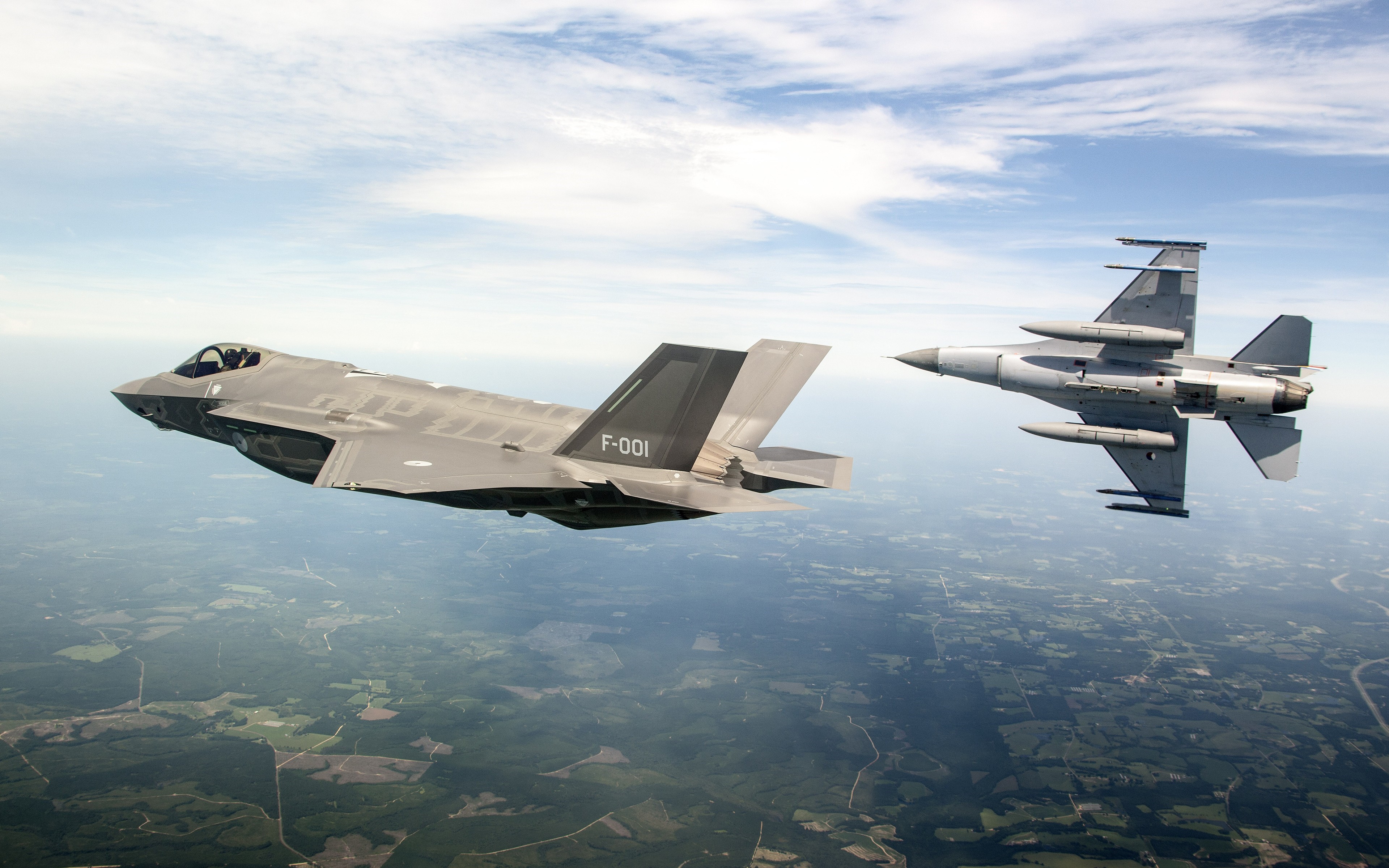 F-35 Lightning II and F-16 Fighting Falcon in Flight HD Wallpaper