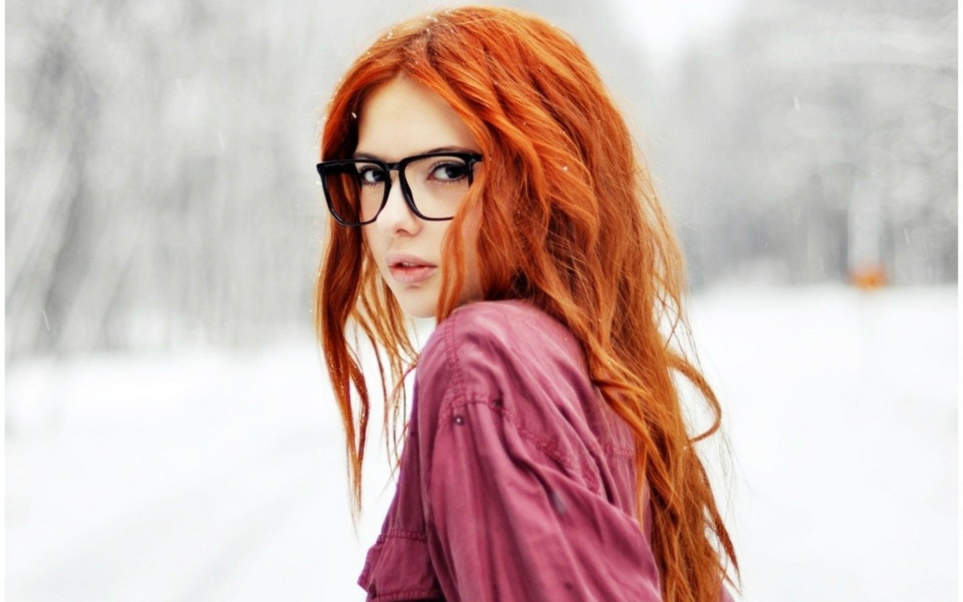 Redhead girl with glasses in the snow HD Wallpaper