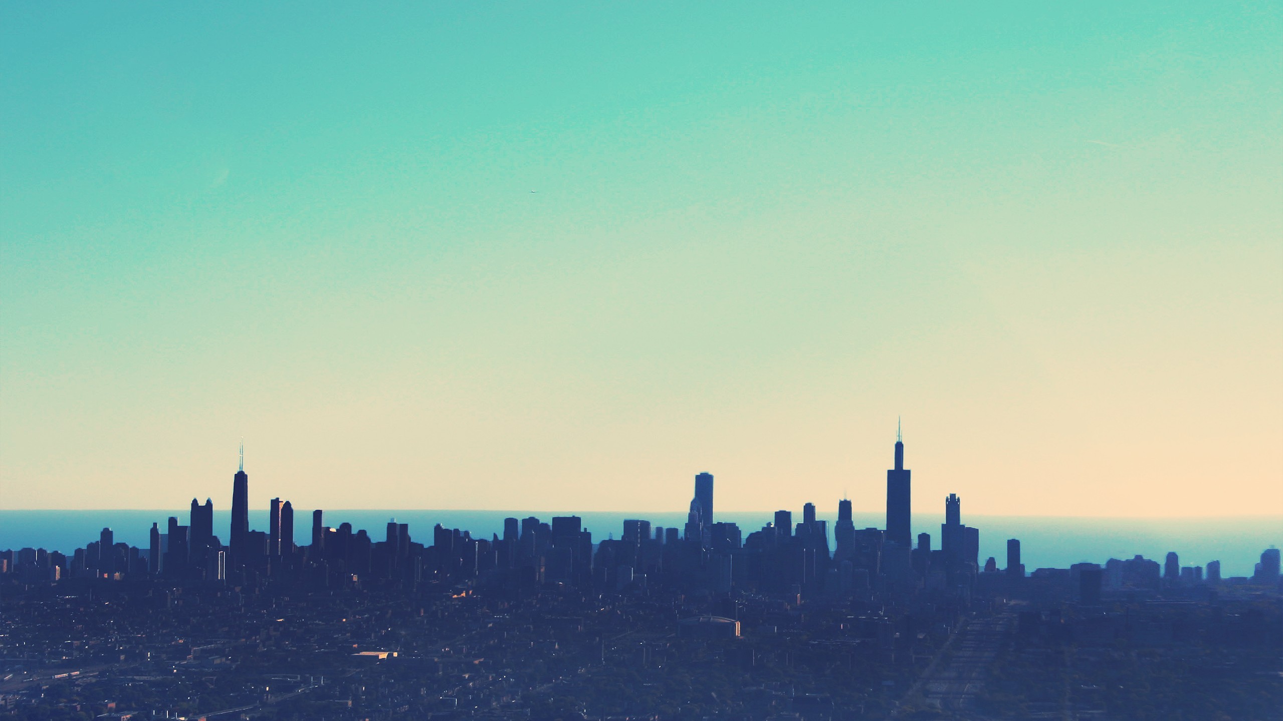 Chicago skyline at dusk with teal and orange sky HD Wallpaper