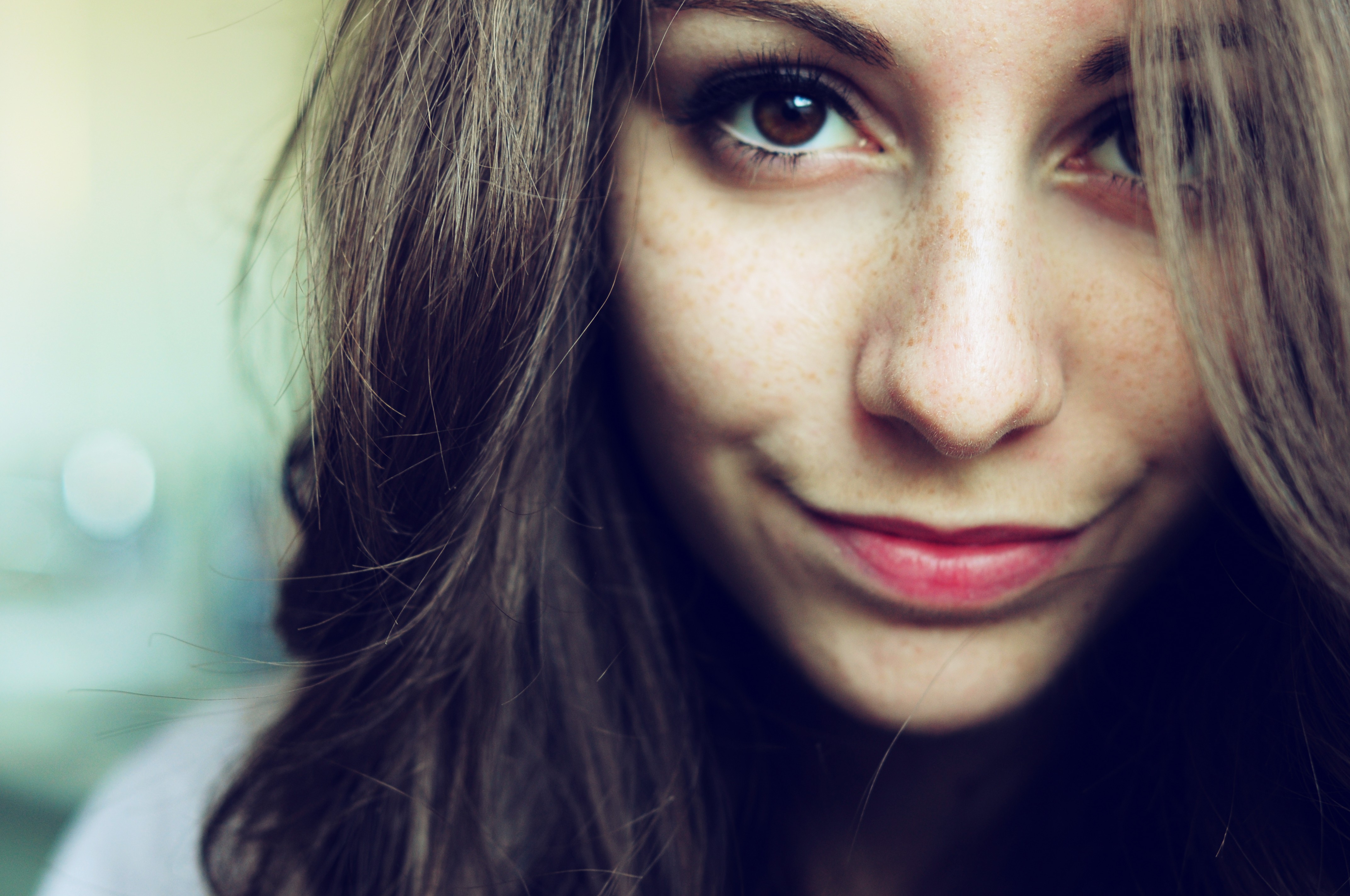 Woman with freckles and brown eyes HD Wallpaper
