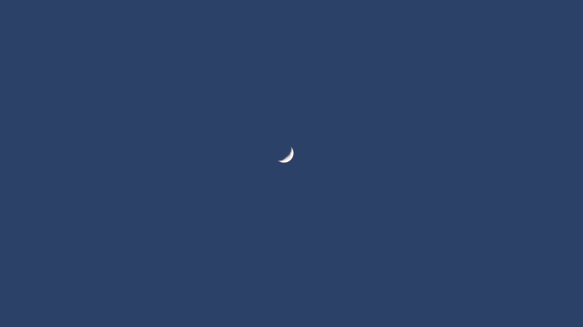 Crescent moon in a clear blue sky HD Wallpaper