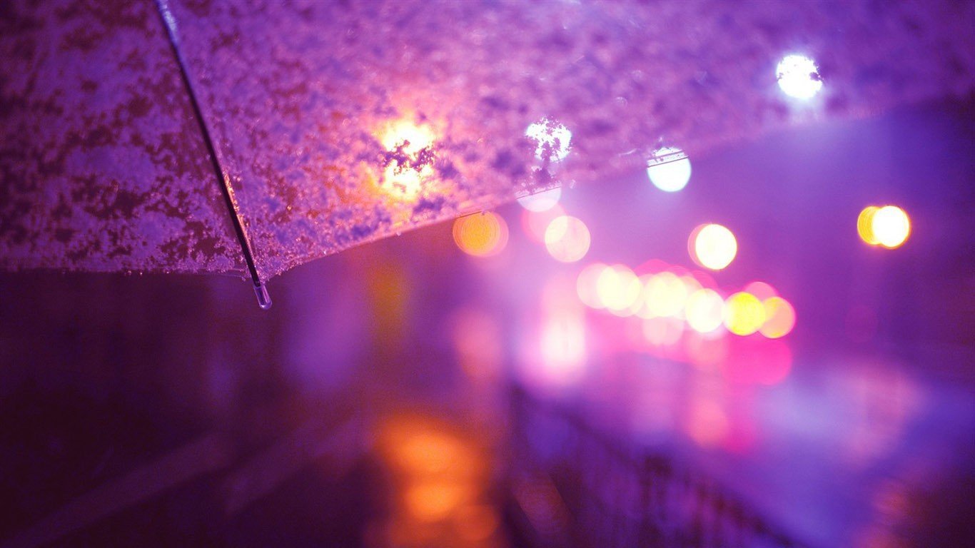 Umbrella in the rain with city lights bokeh HD Wallpaper